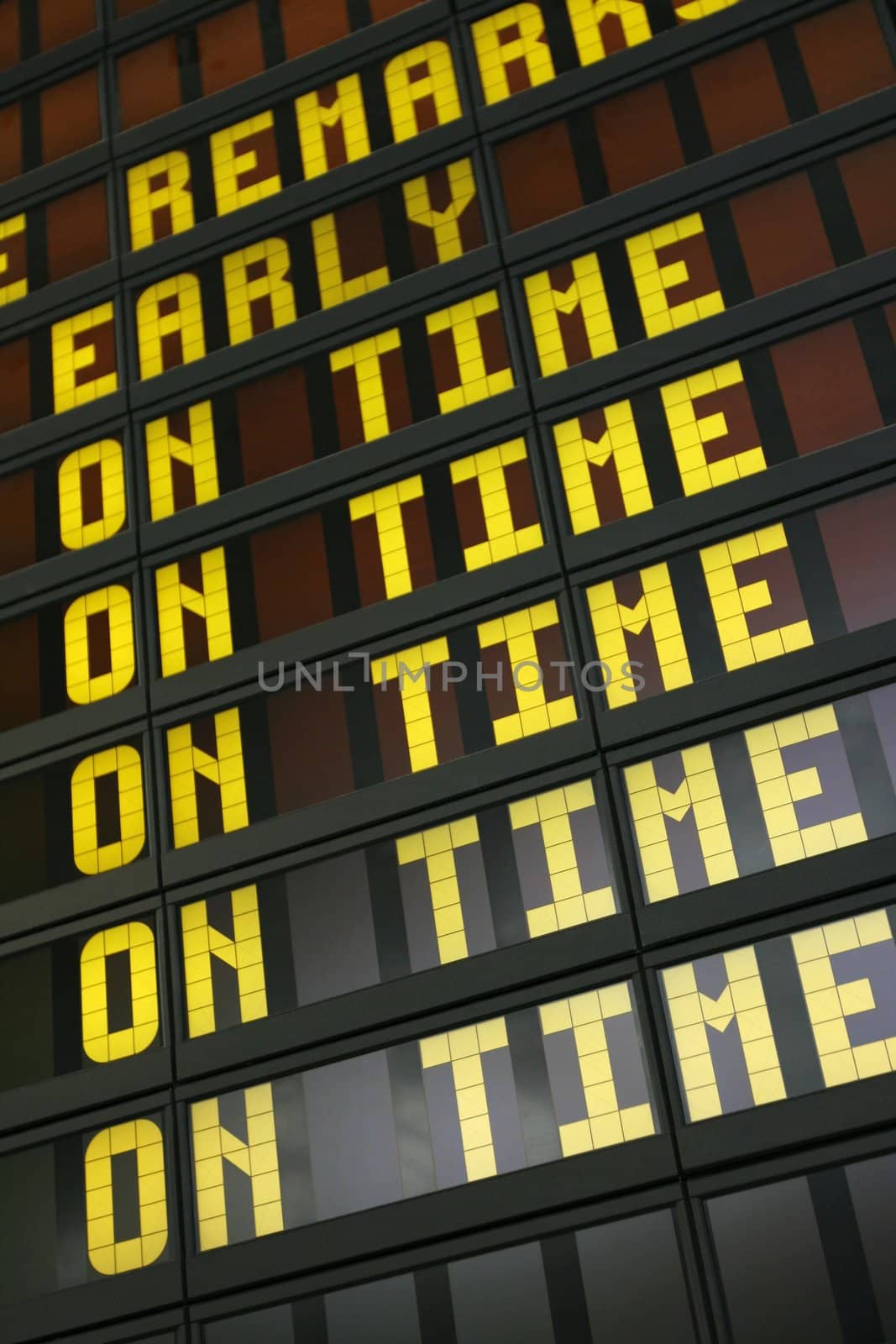 Airport board showing arrivals and departures on time