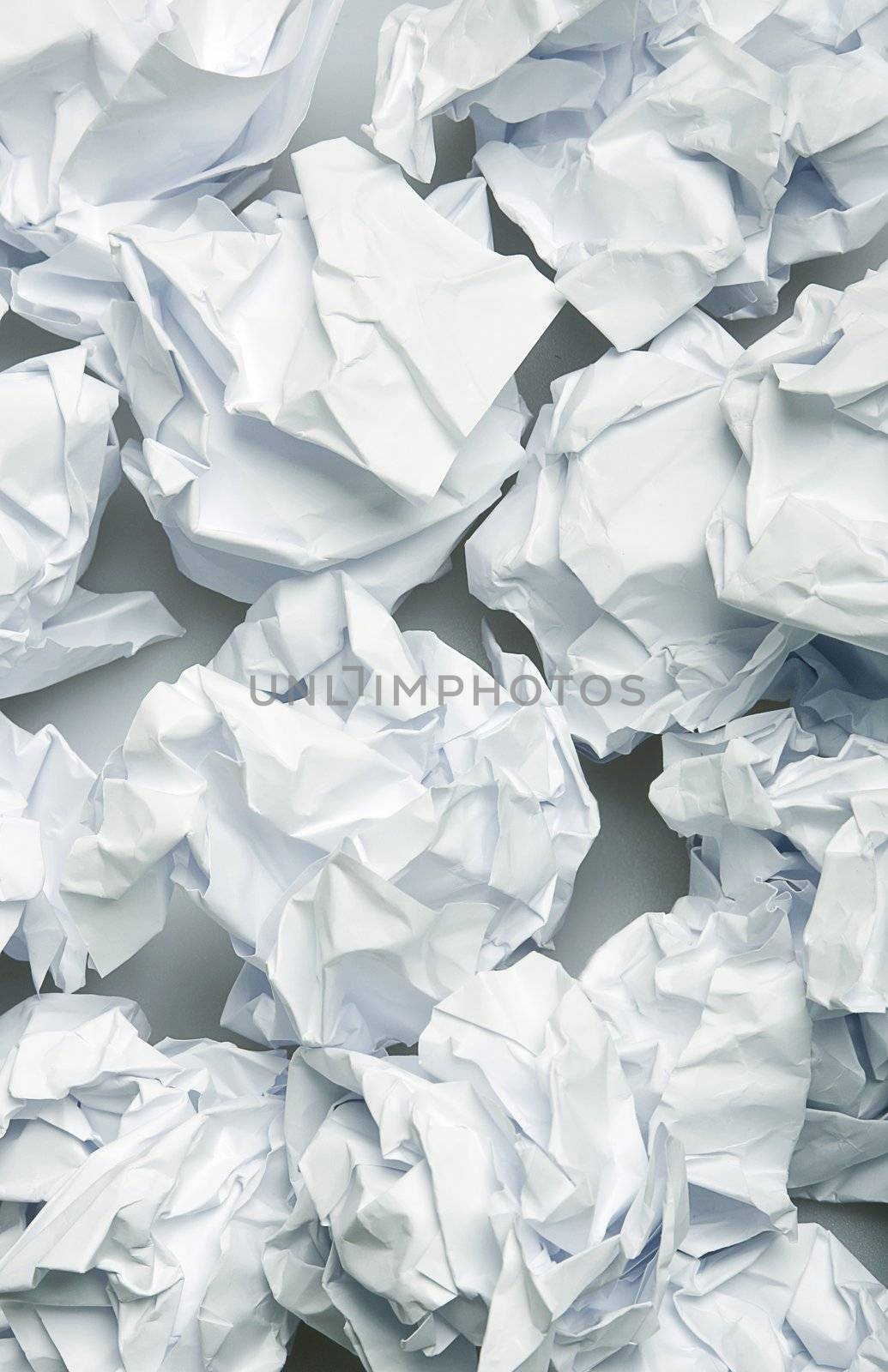 Crumpled paper wads after brainstorming