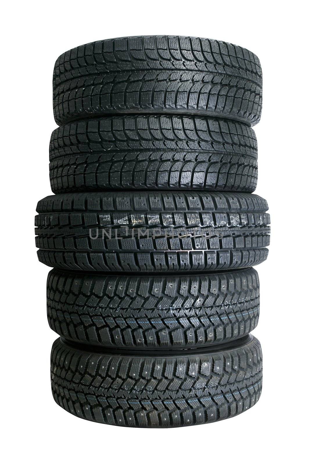 Brand new tires stacked up and isolated on white background