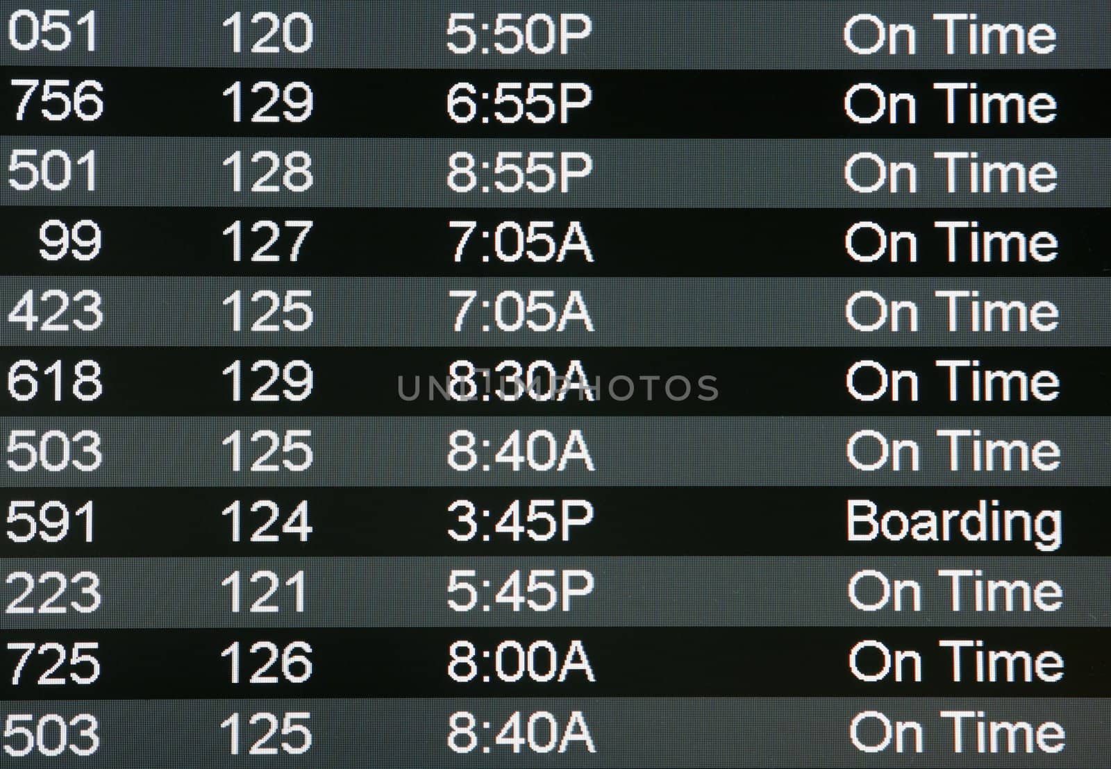 Digital airport board showing arrivals and departures on time