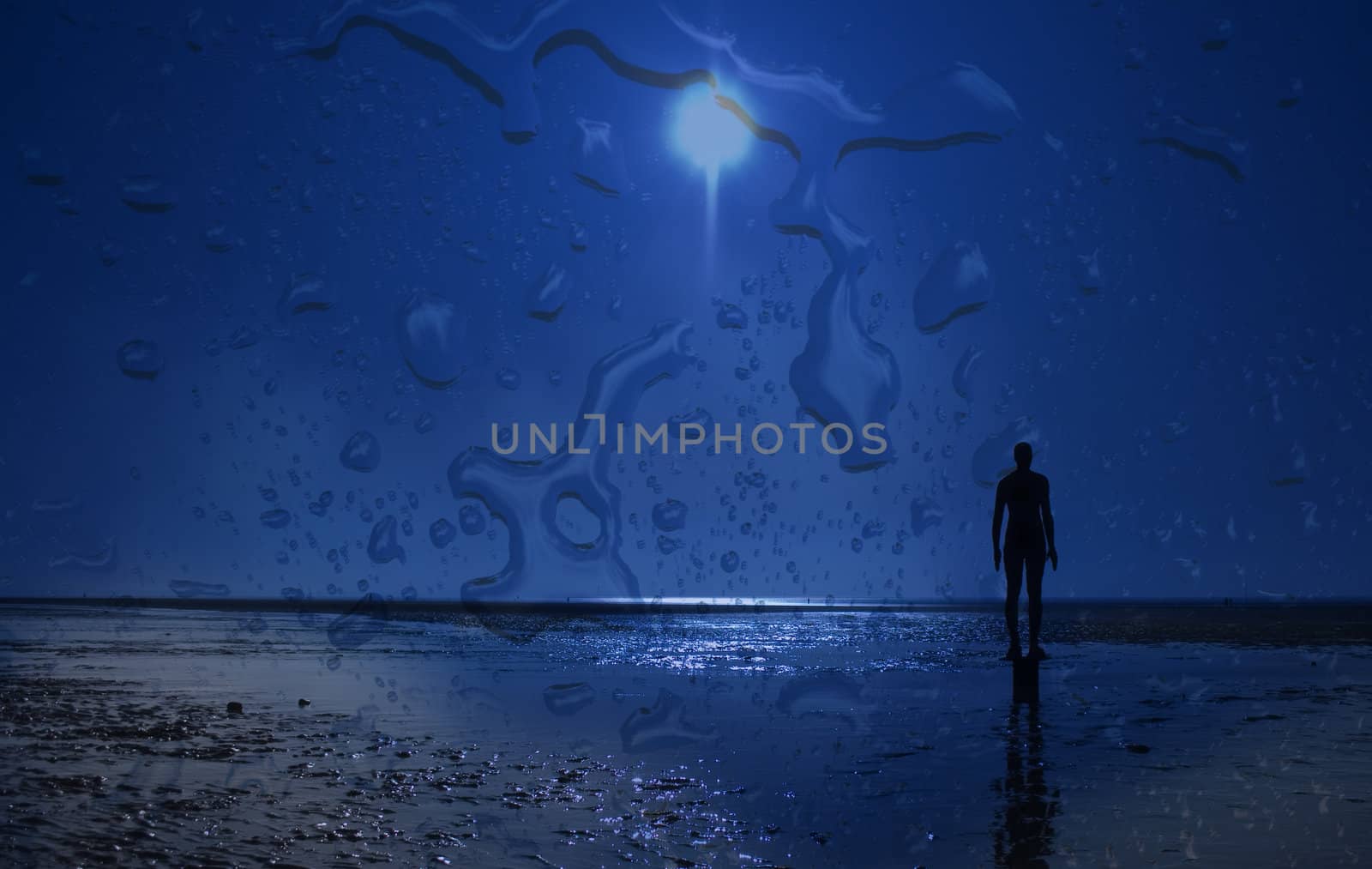 Iron statue on the beach silhouette against a clear blue sky through a rain splashed window