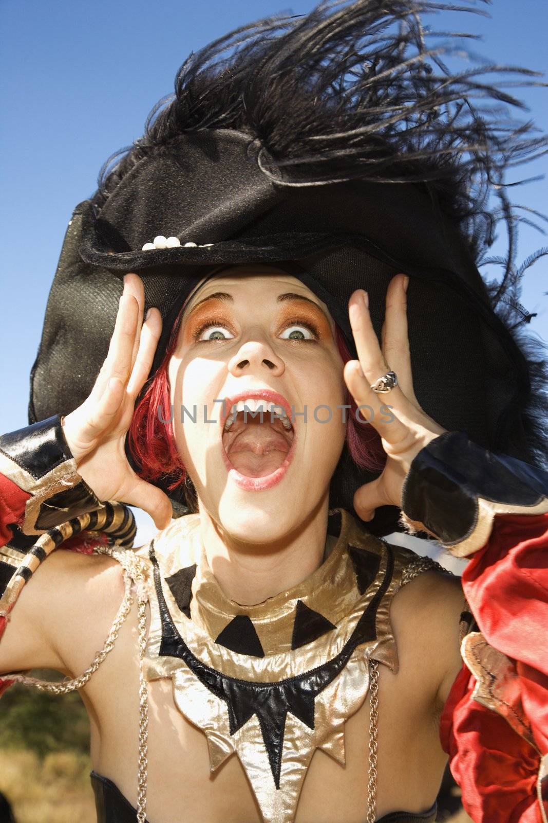 Close up of young adult Caucasian female dressed in pirate costume.