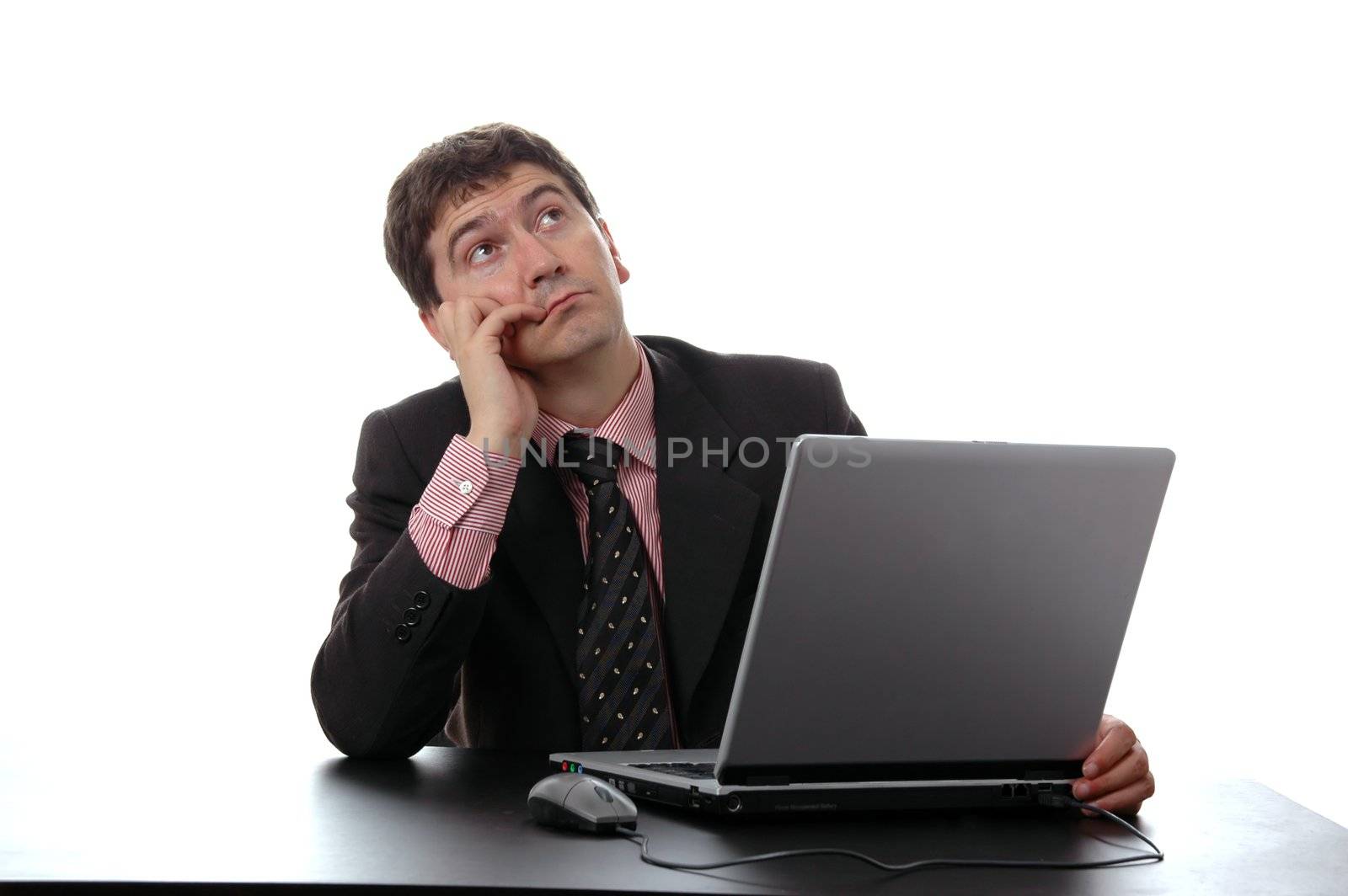 young businessman with lapton in the table