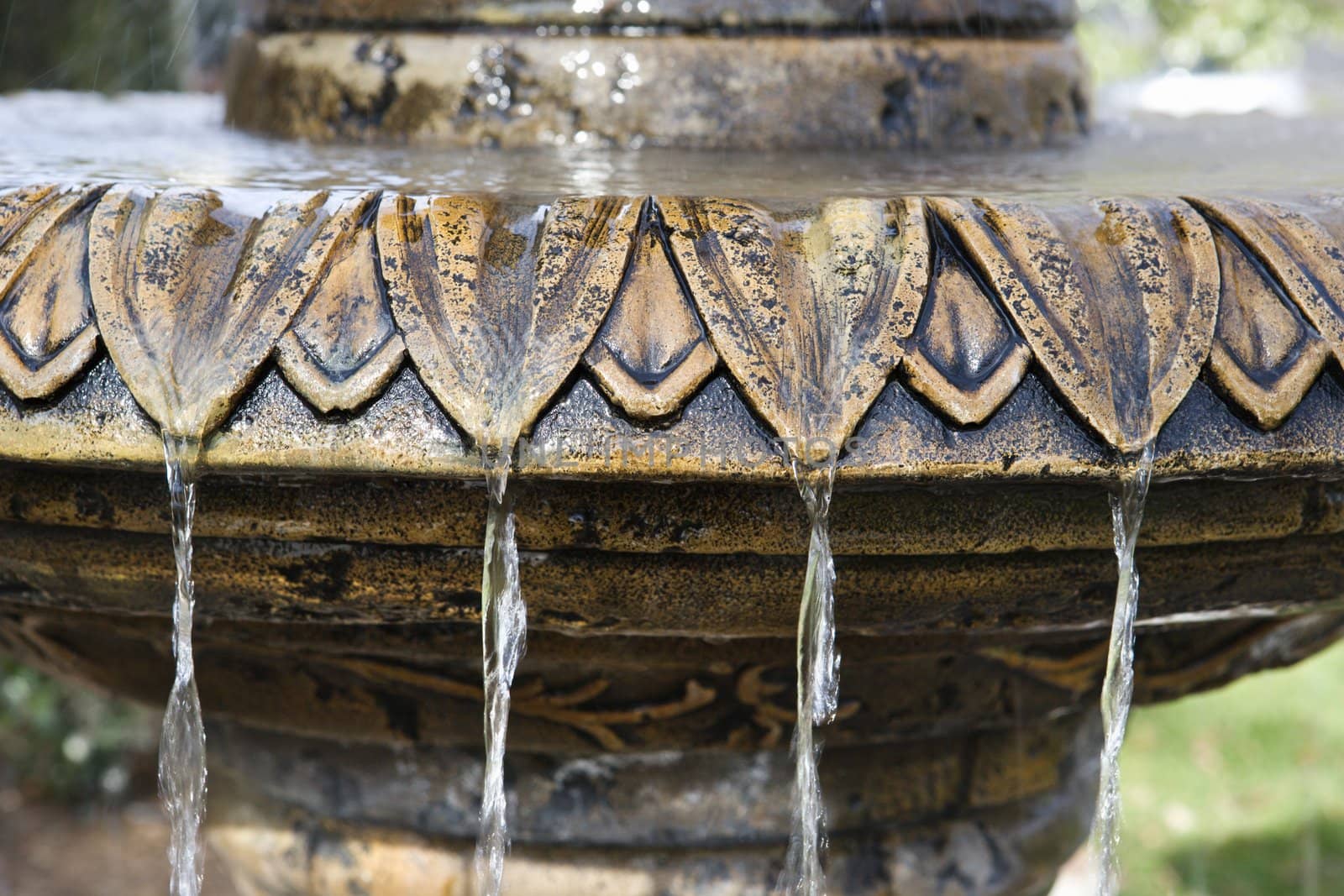 Close-up of fountain with water flowing from it.