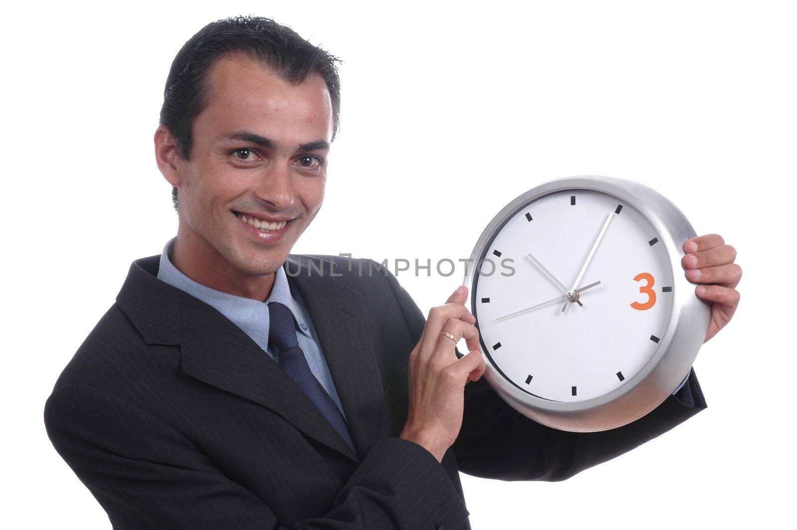 young businessman holding wall clock