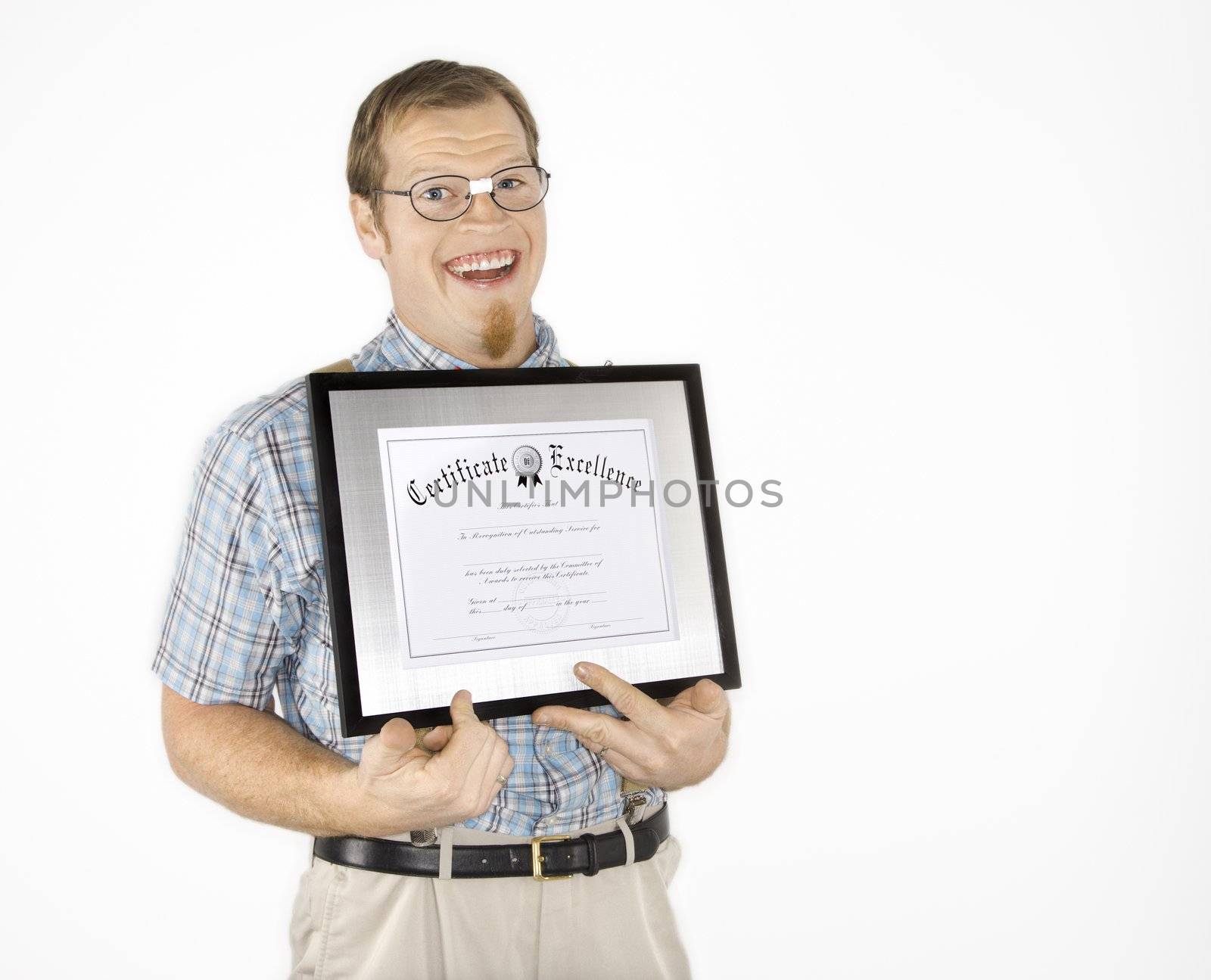 Caucasian young man dressed like nerd holding certificate and smiling.