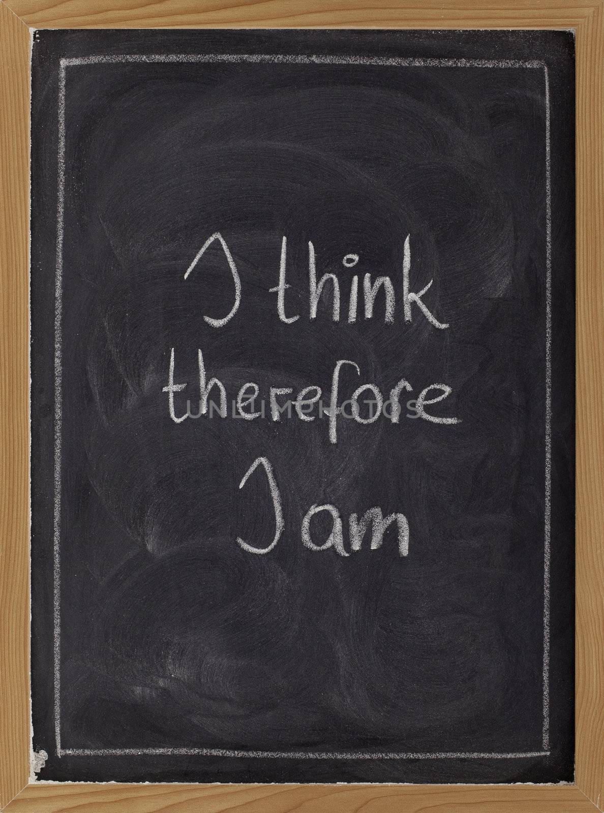 I think, therefore I am - philosophical statement used by Rene Descartes; white chalk handwriting on blackboard