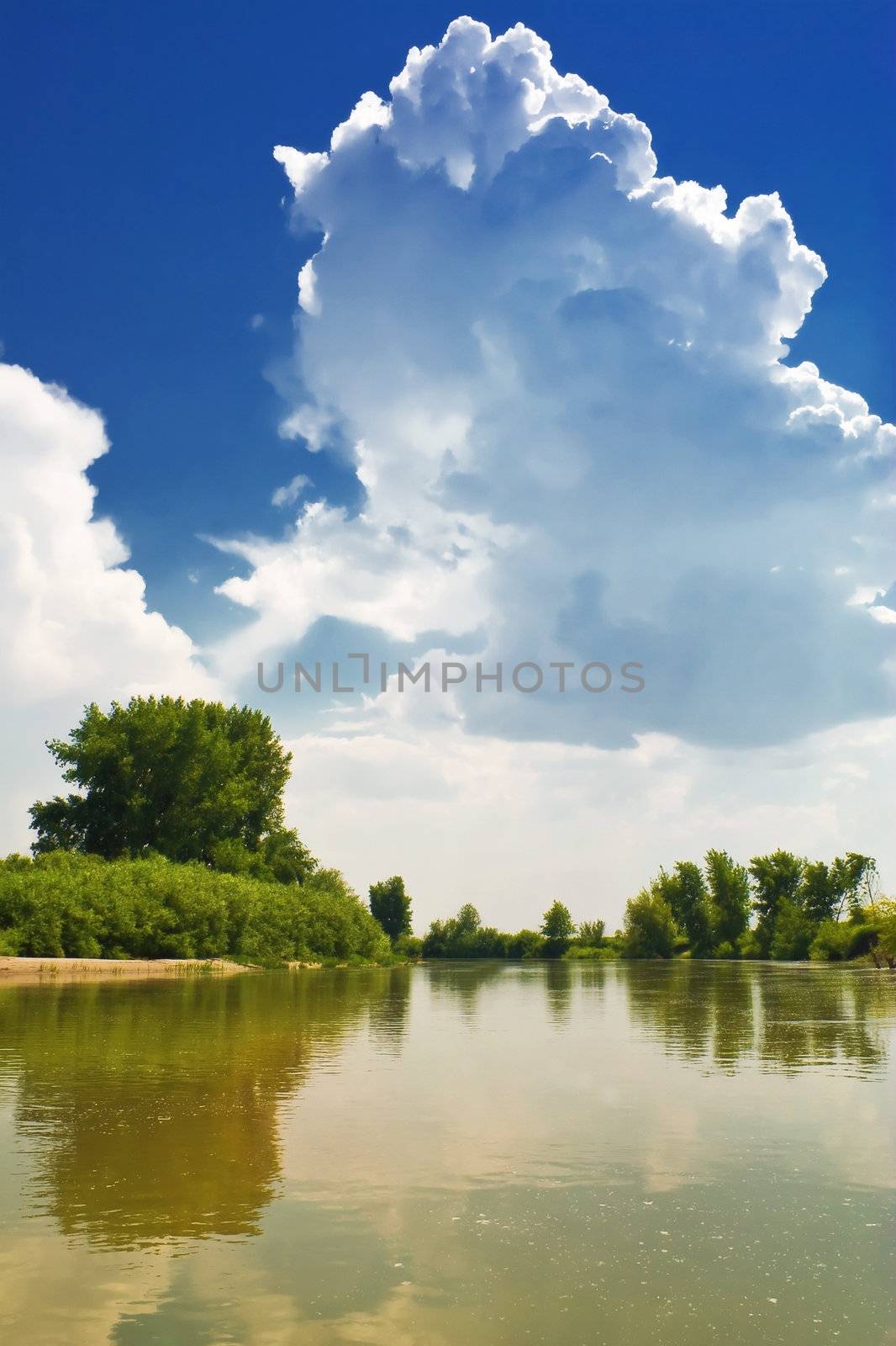 A cloud against a backdrop of blue sky. Landscape by the river by selhin