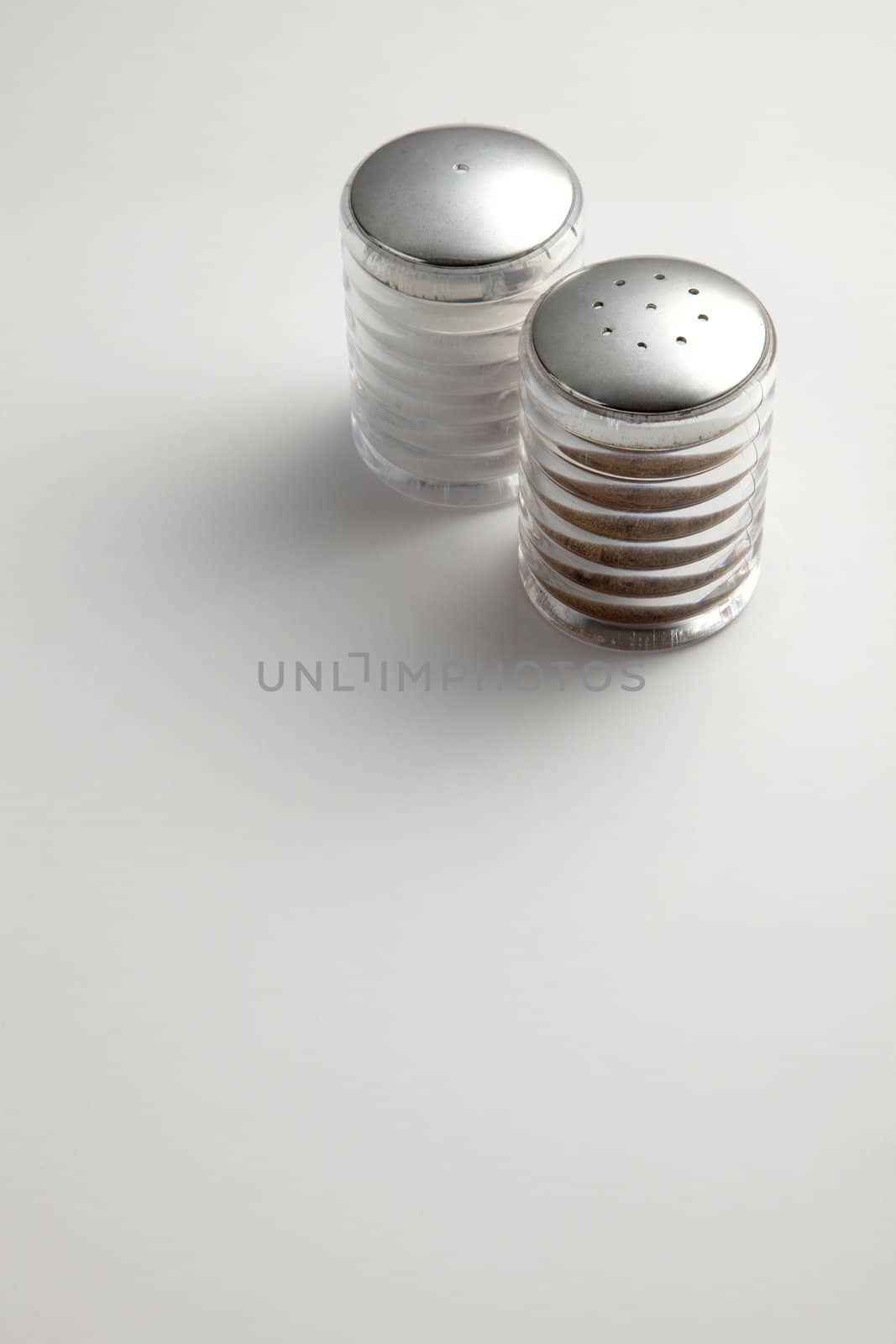 Salt and Pepper Shakers on the plain background