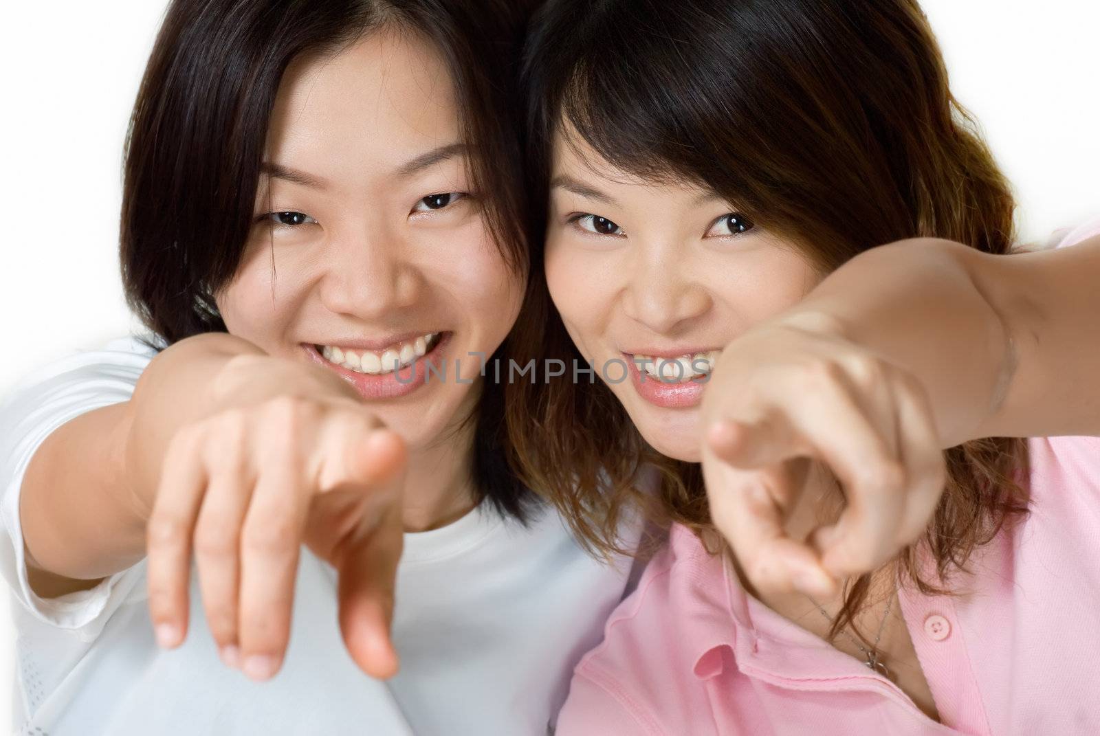 Happy smile friends of Asian women pointing.