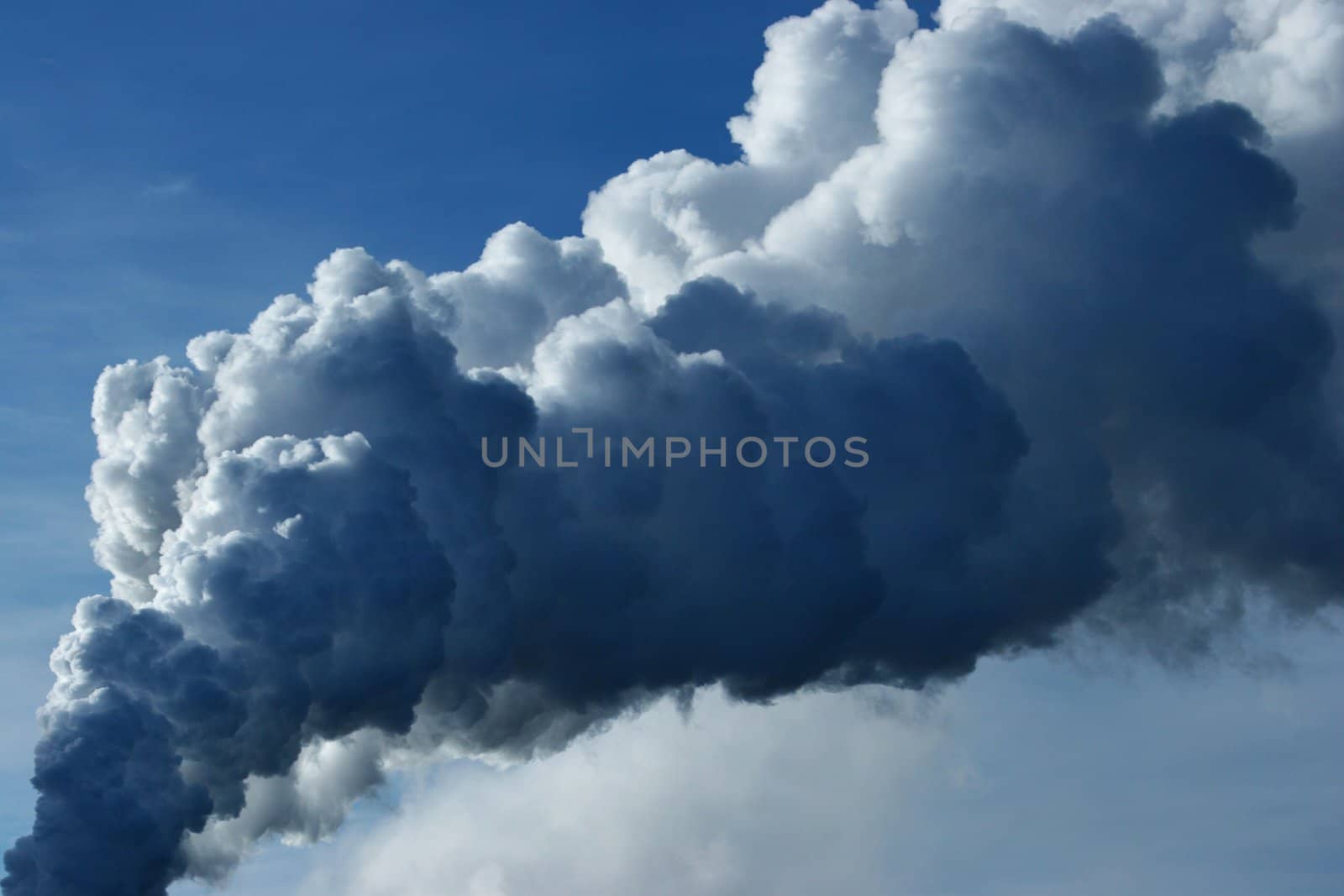 Giant smoke pillar rising up into the sky