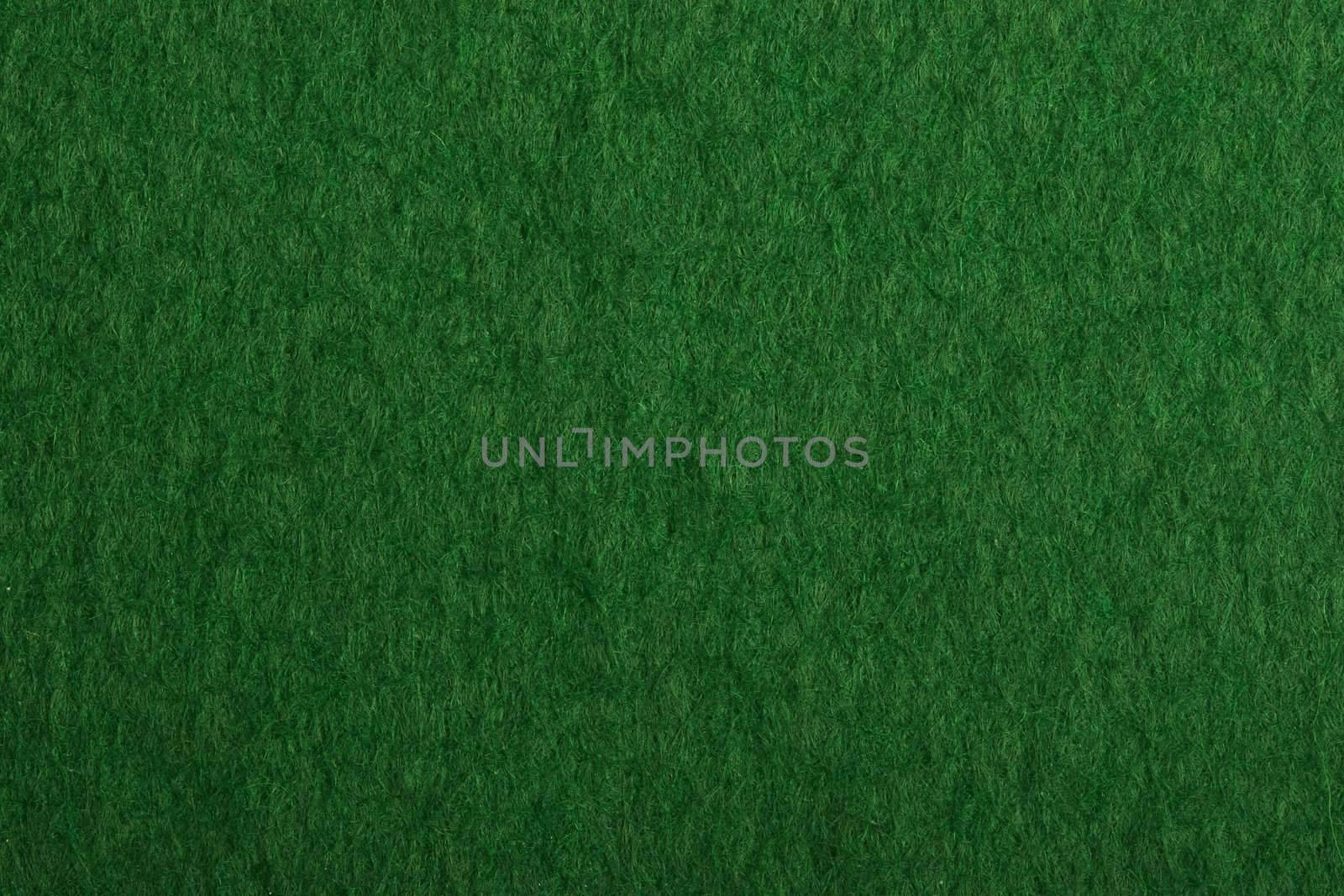Close-up of a green poker table felt surface