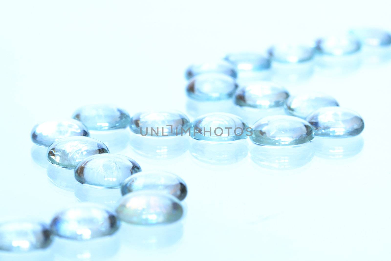 Abstract light blue background made from row of glass balls with reverberation