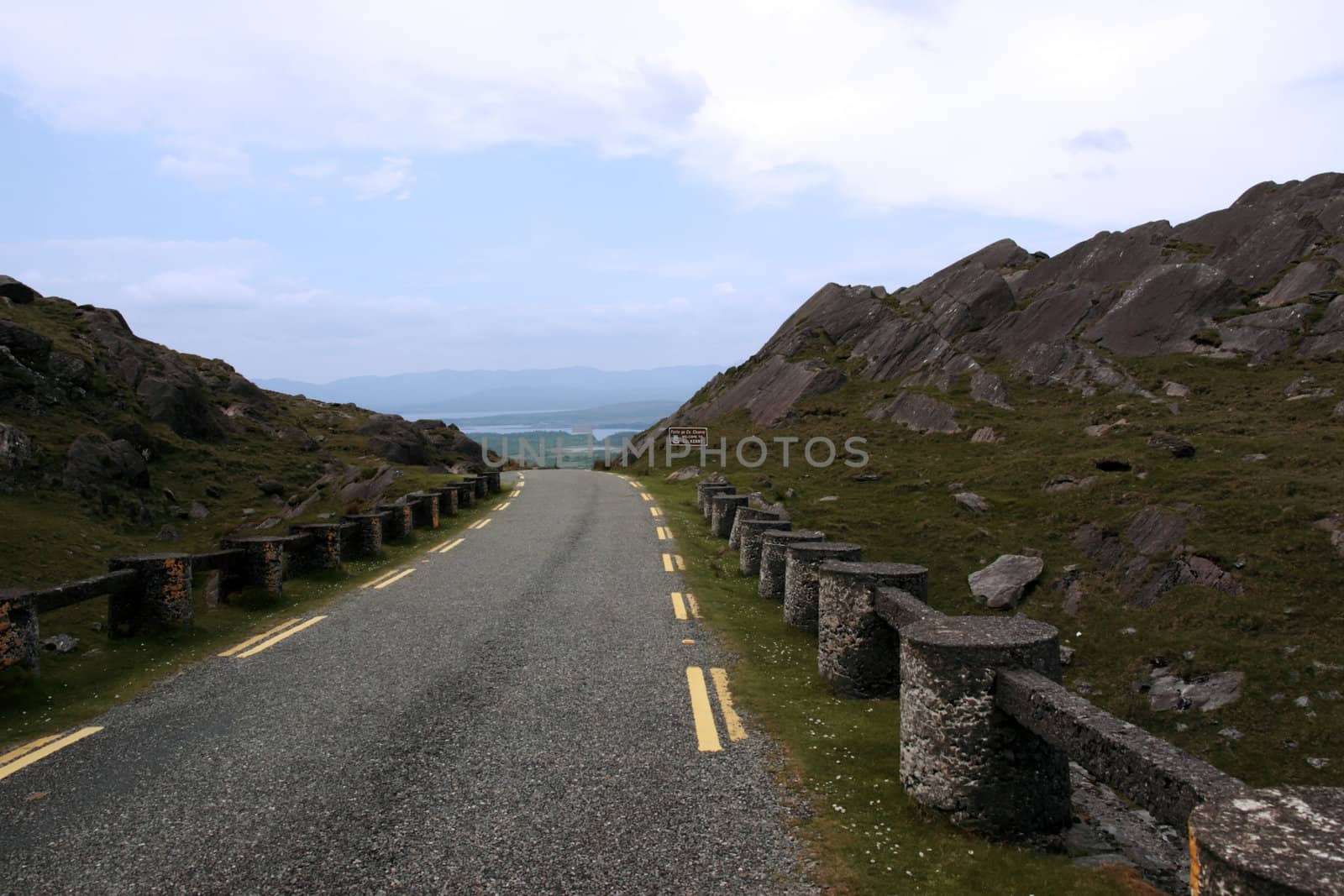 an evenings view of winding roads through the mountains of kerry