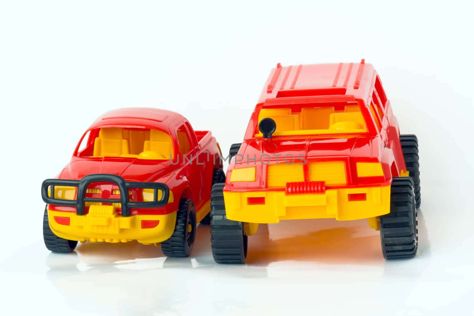 Two toy cars, isolated on a white background.