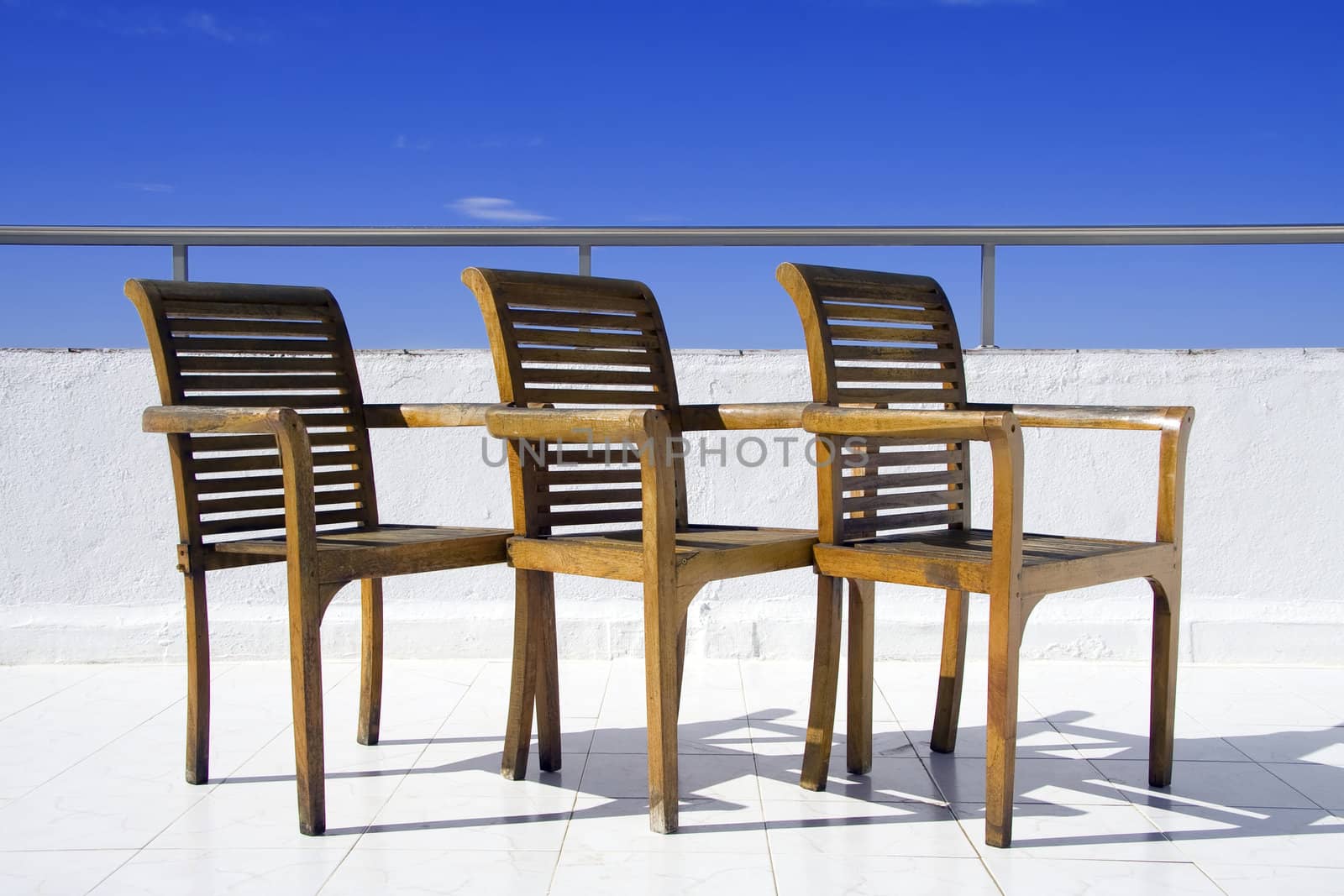 Three chair on balcony by Sazonoff