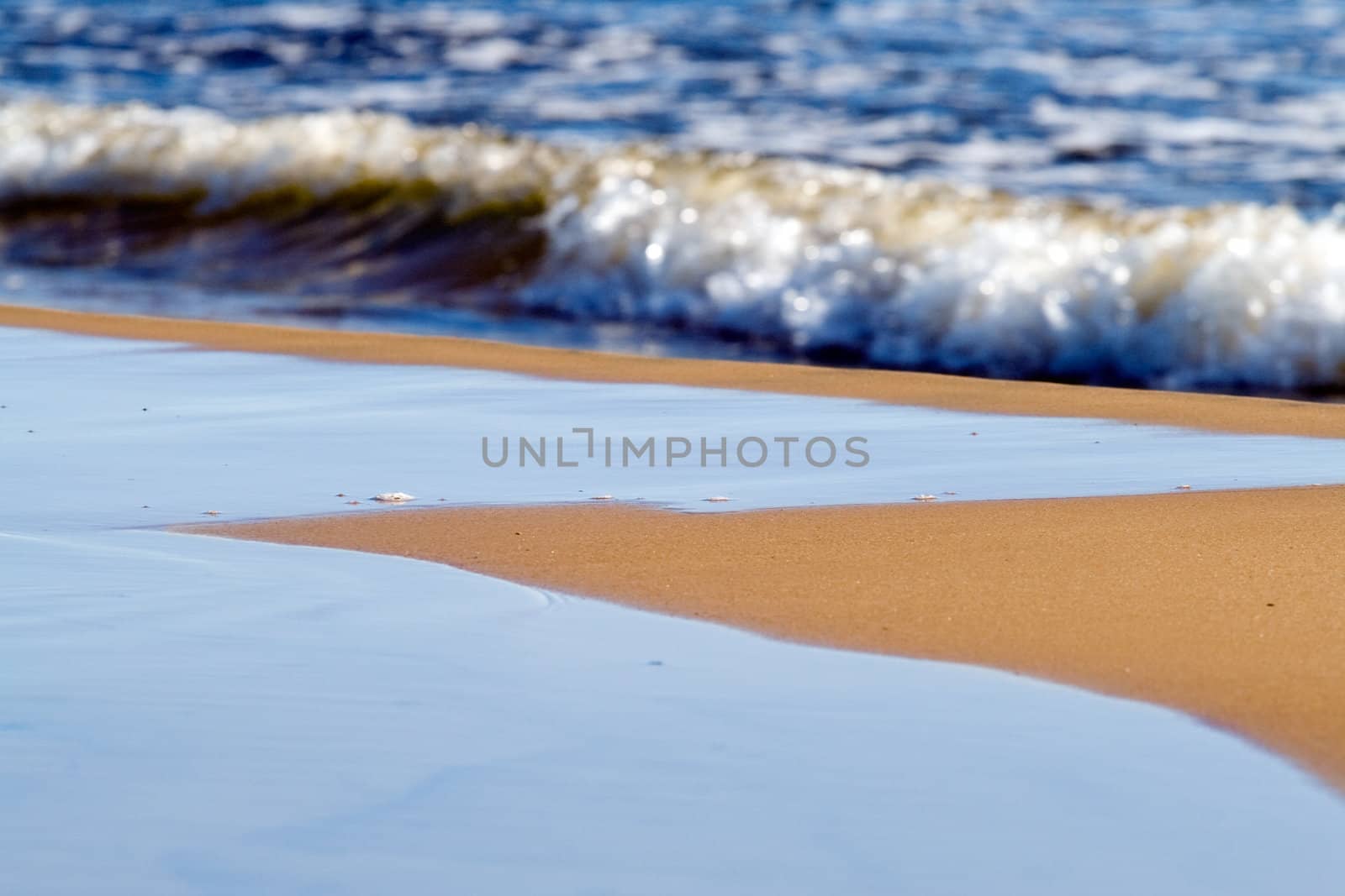 Beach sand and sea water waves background