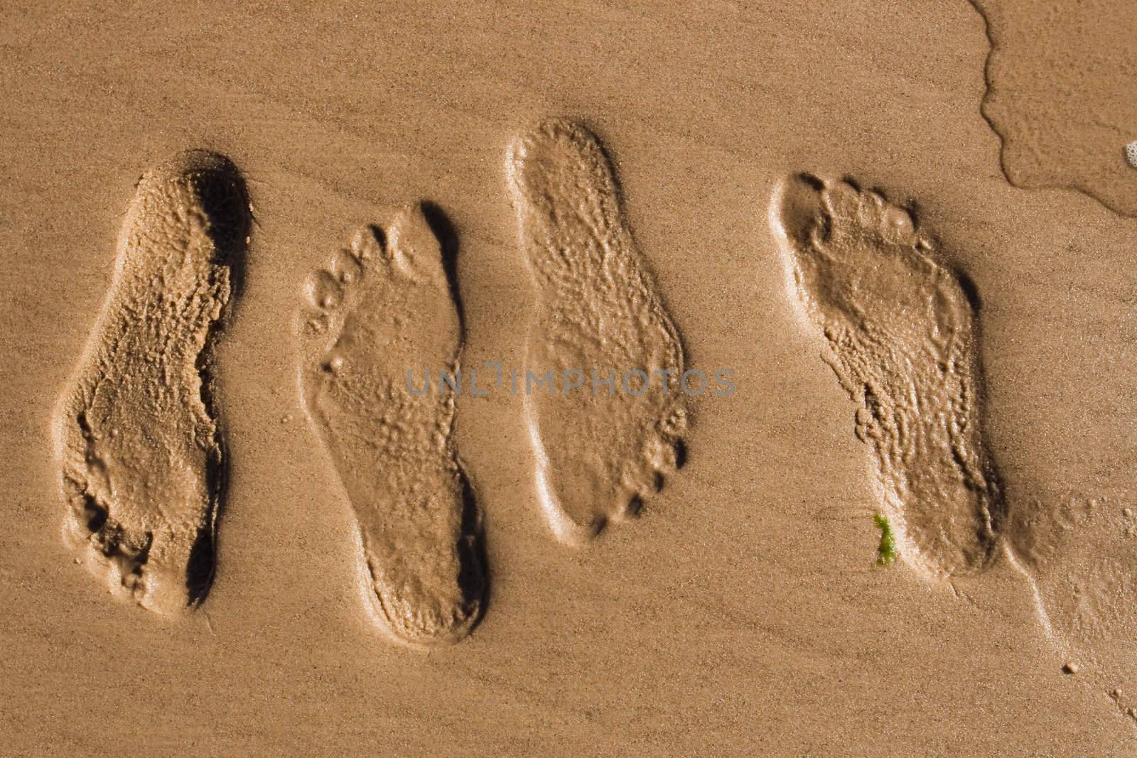 Footprints in sand by ints