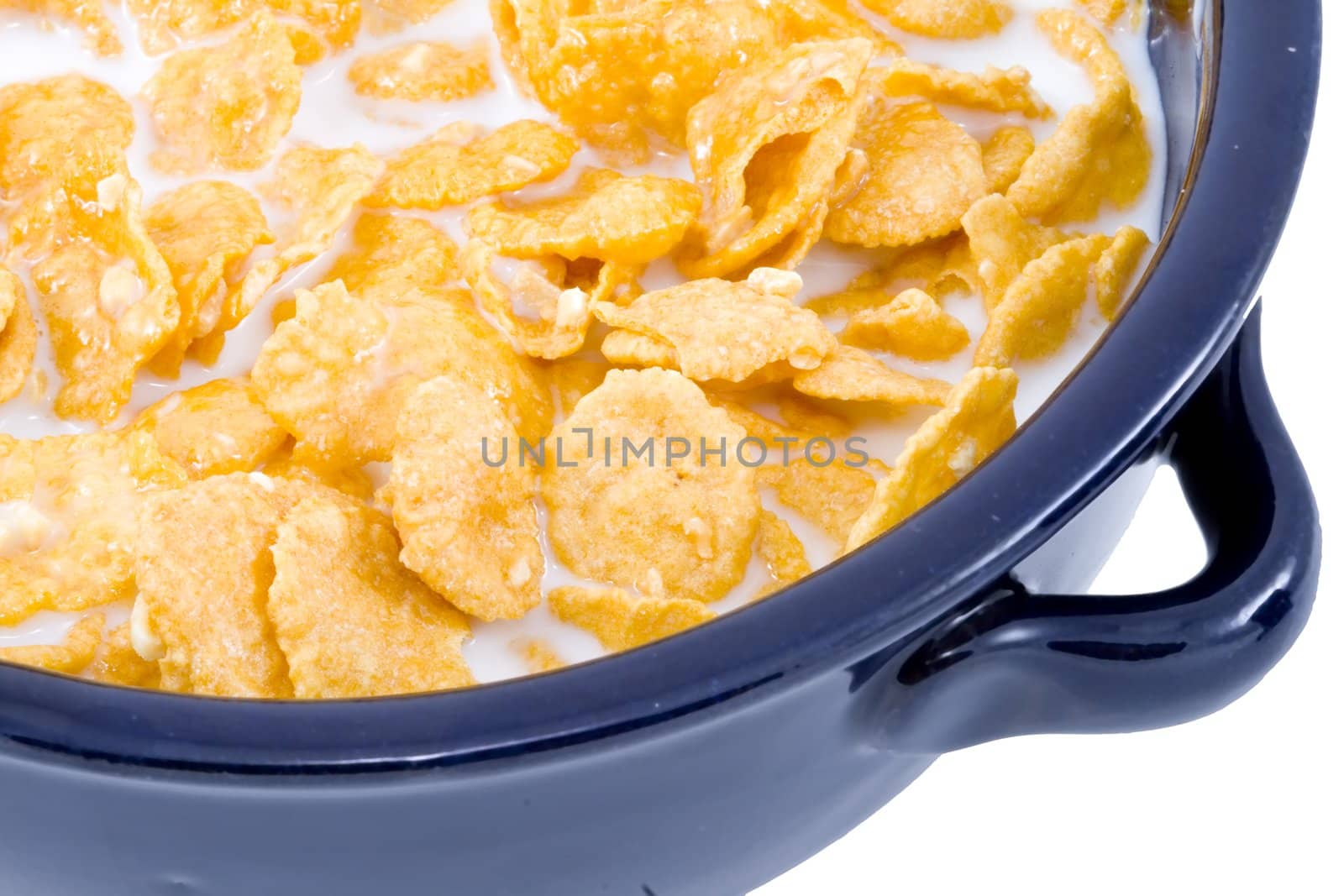 a bowl of cornflakes with milk - healthy diet