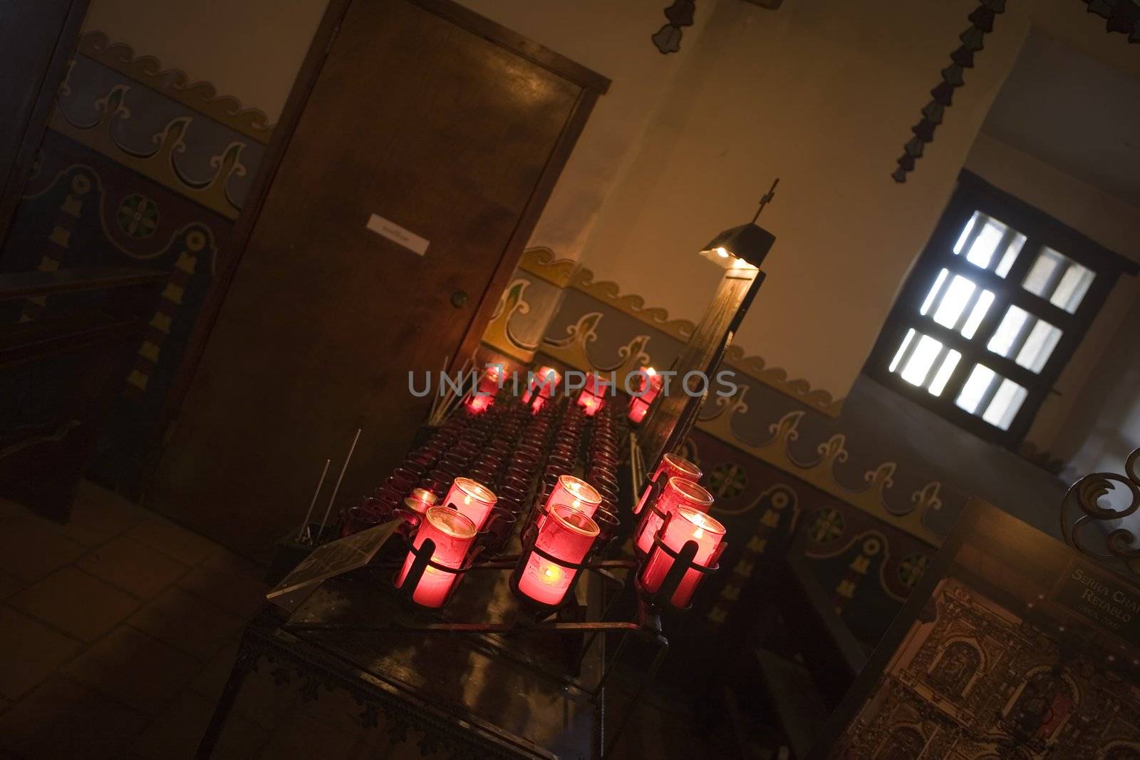 Candles and Pew at Mission San Juan Capistrano by KevinPanizza
