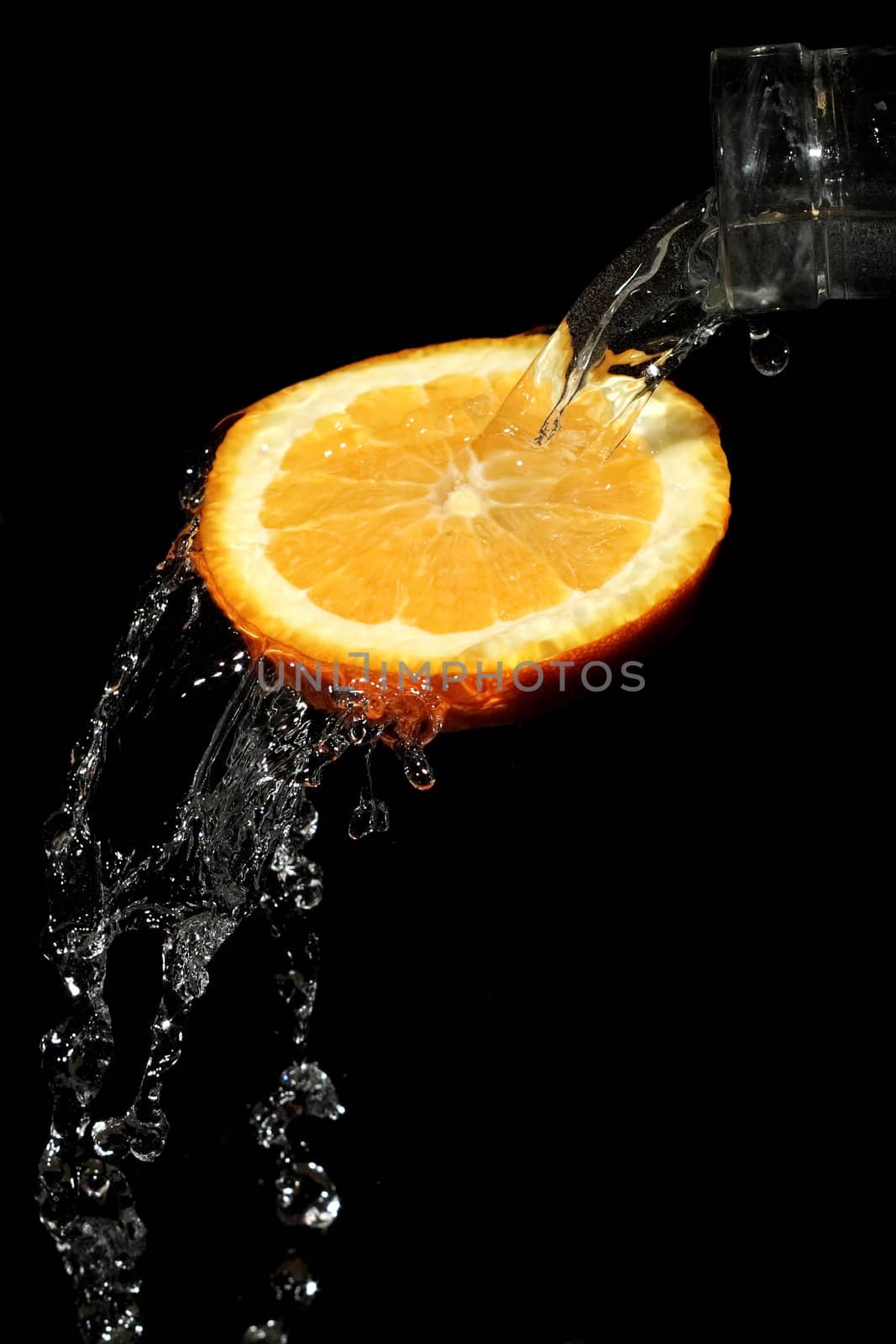 The water which is flowing down from segments of fruit
