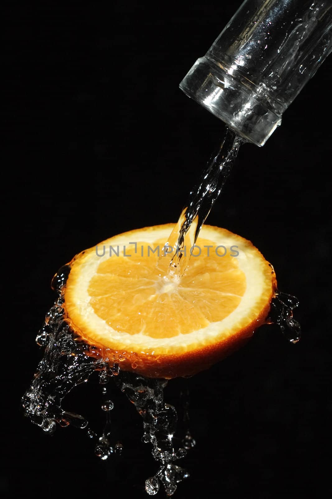 The water which is flowing down from segments of fruit
