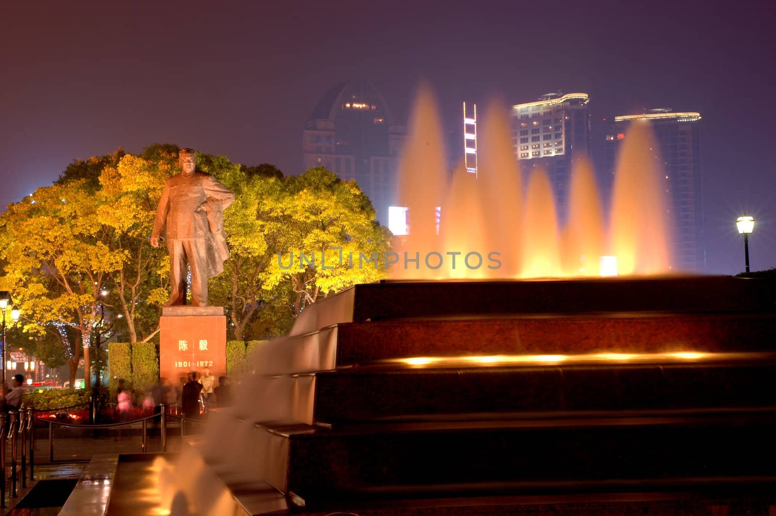 Shanghai in China. City center - WaiTan, promenade with monument of first mer and fountain.