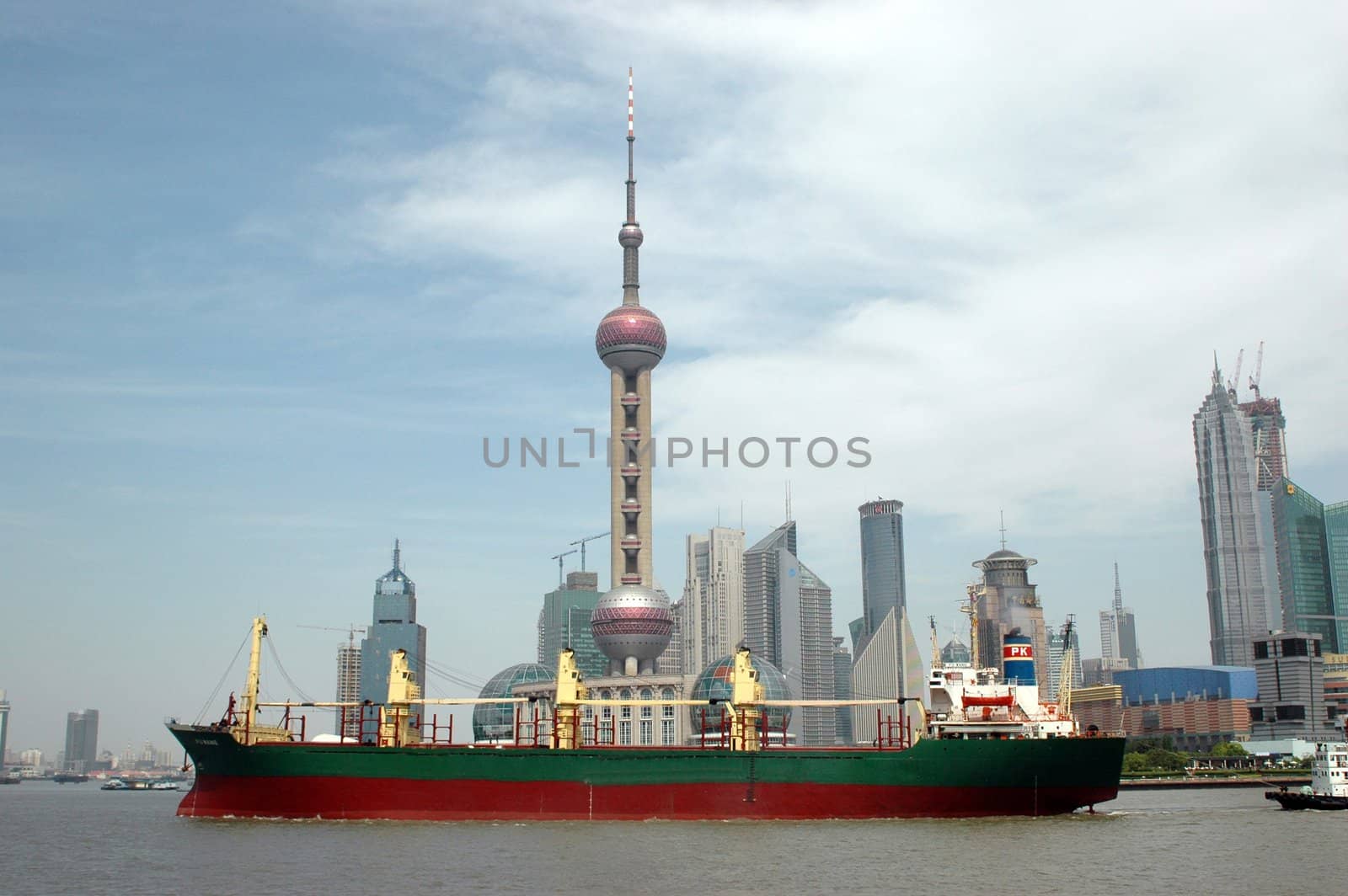 China, Shanghai - general city view, Orient Pearl TV tower, moderns skyscrapers and vessel.