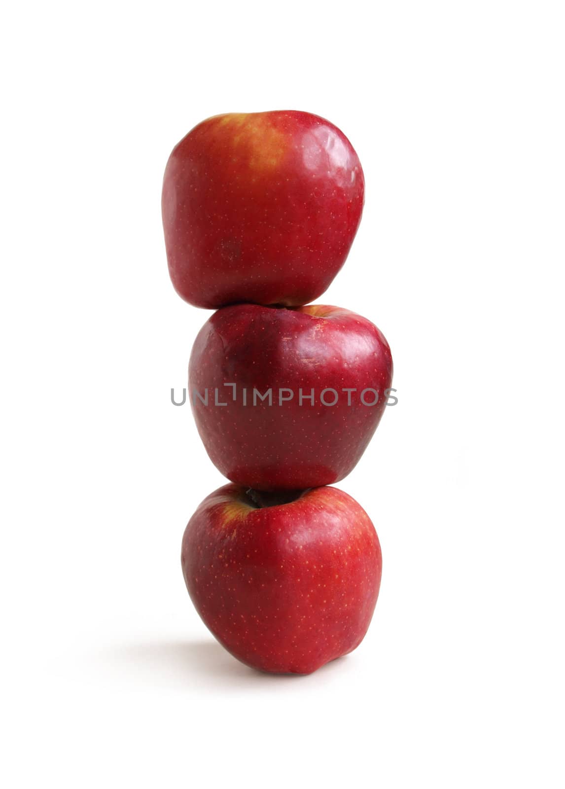 Stack of red apples on a white background