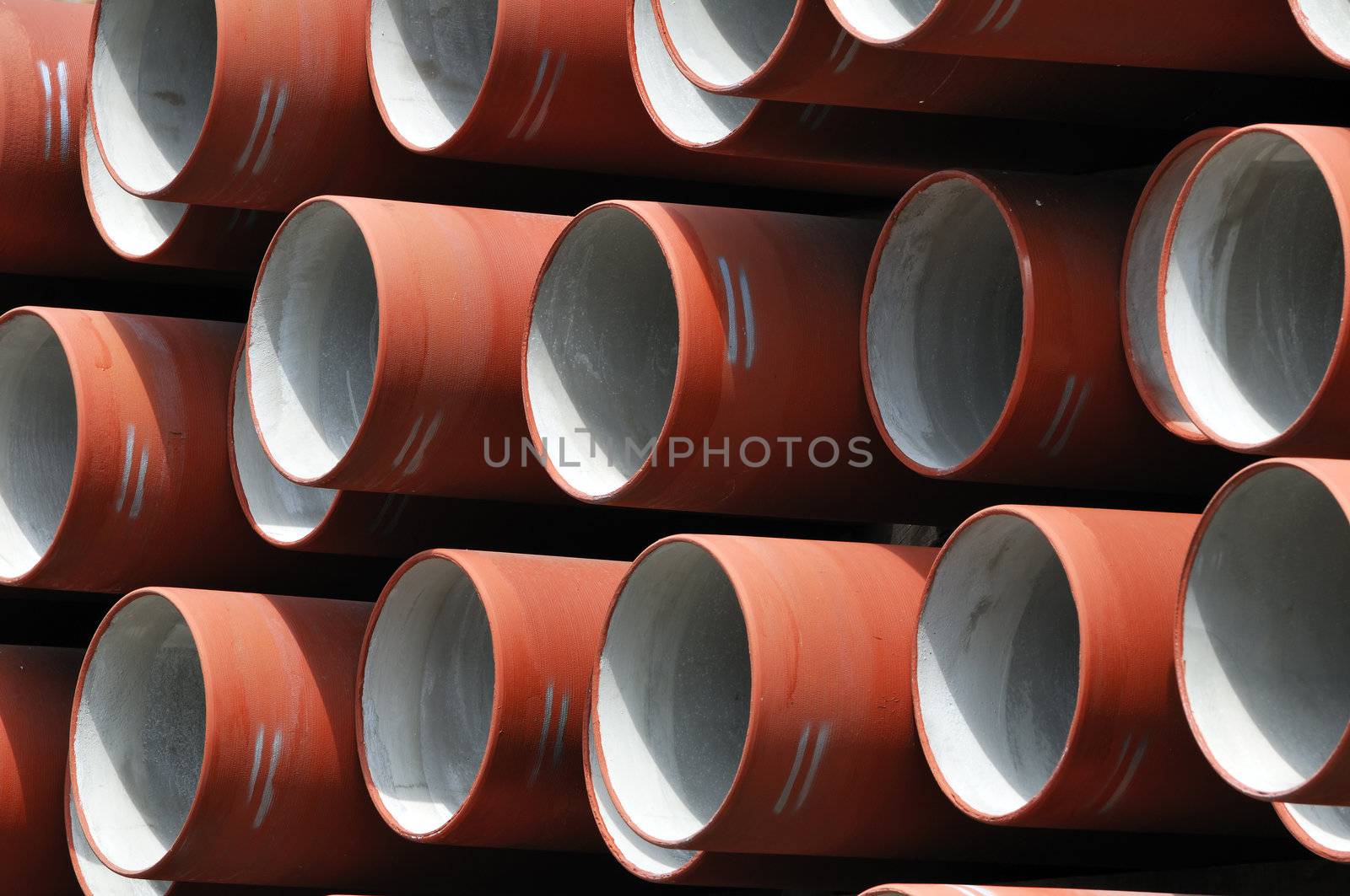 Stack of red pipes