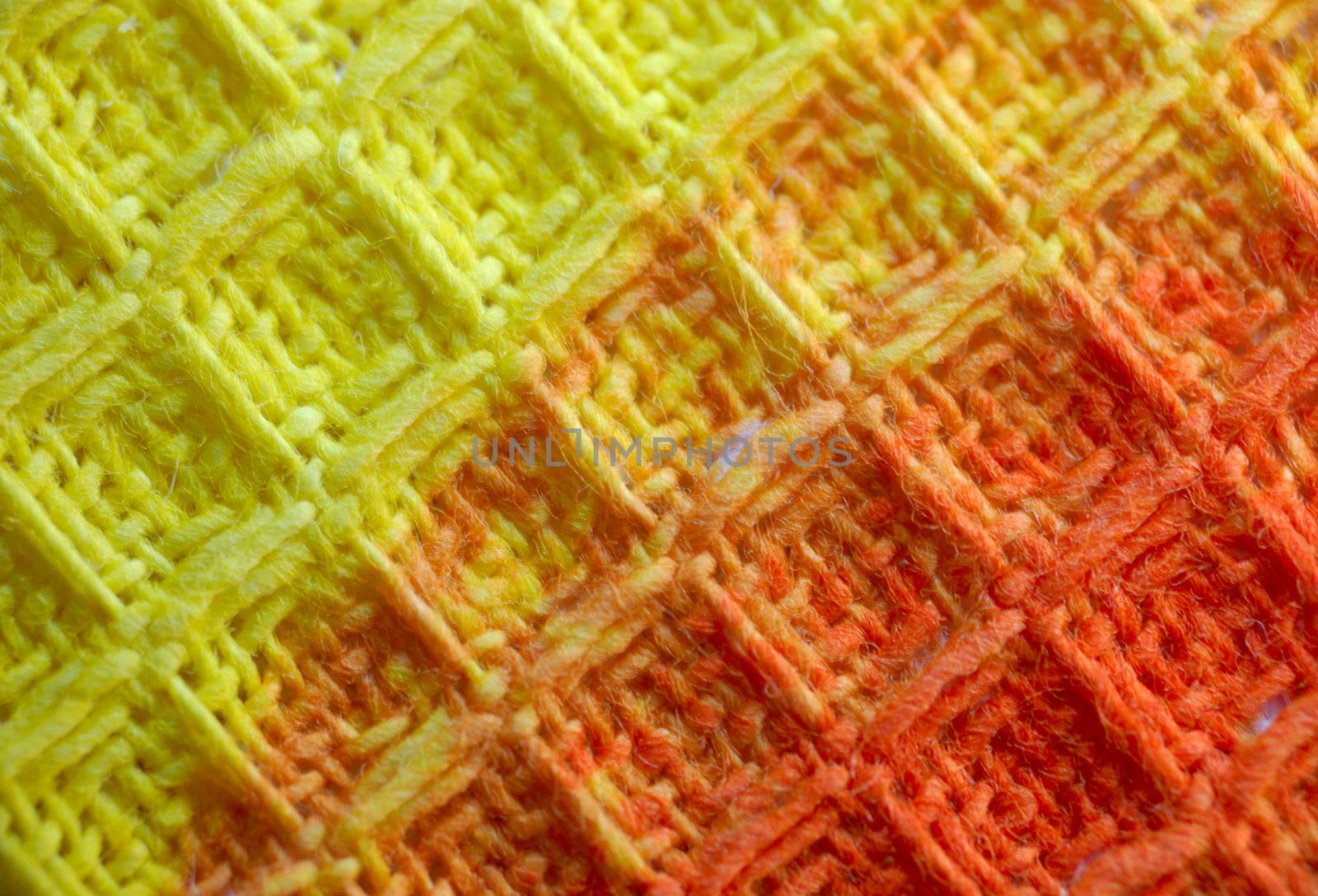 macro pattern of yellow - red textile fabric