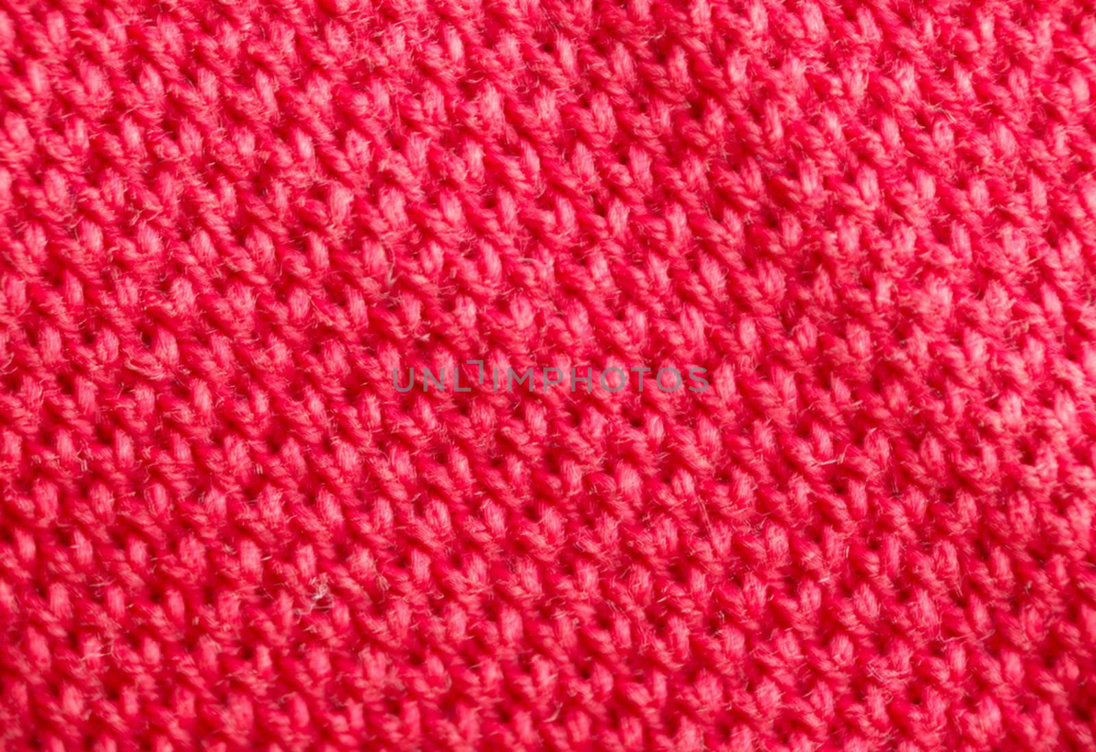 macro pattern of red textile fabric .