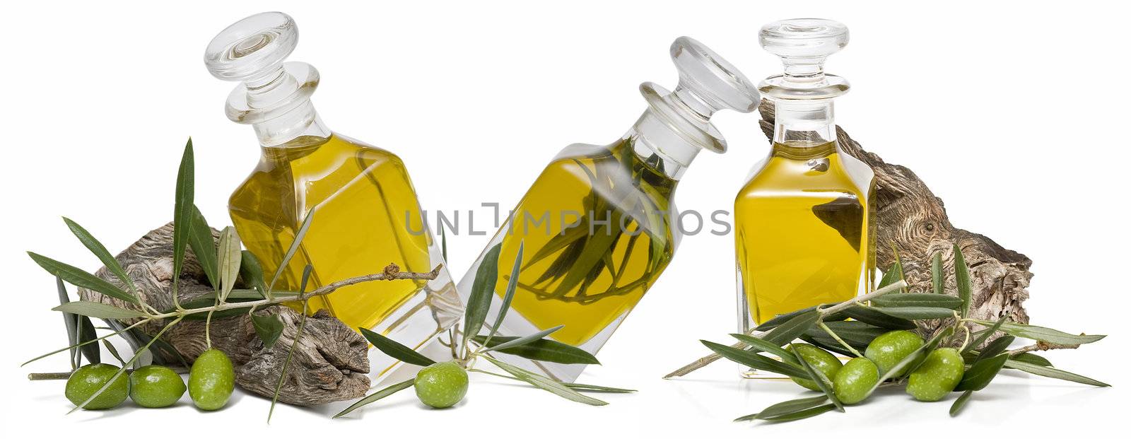 Olive oil bottle witn olives and olive branches isolated on white background.