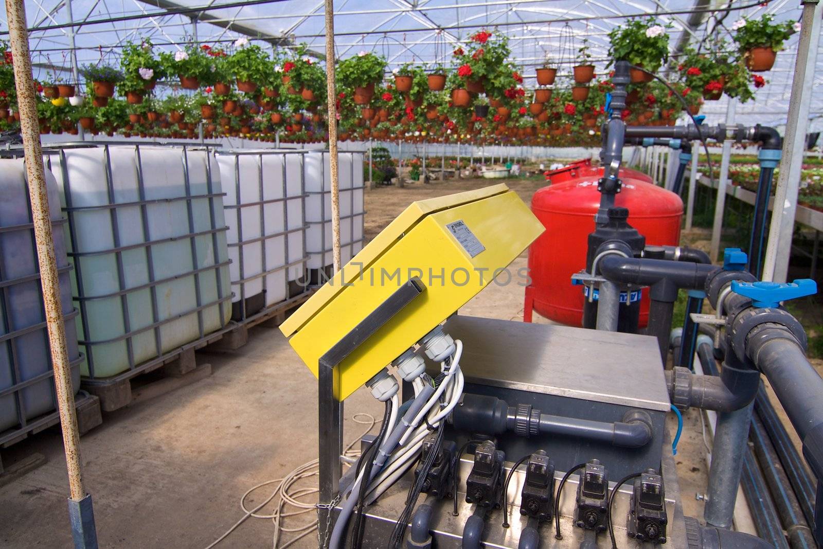 Glasshouse with plants and fertilization equipment