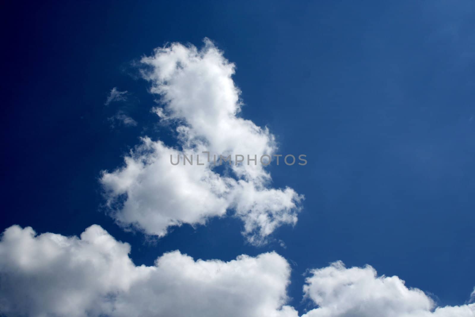 Dark blue sky with white clouds 3