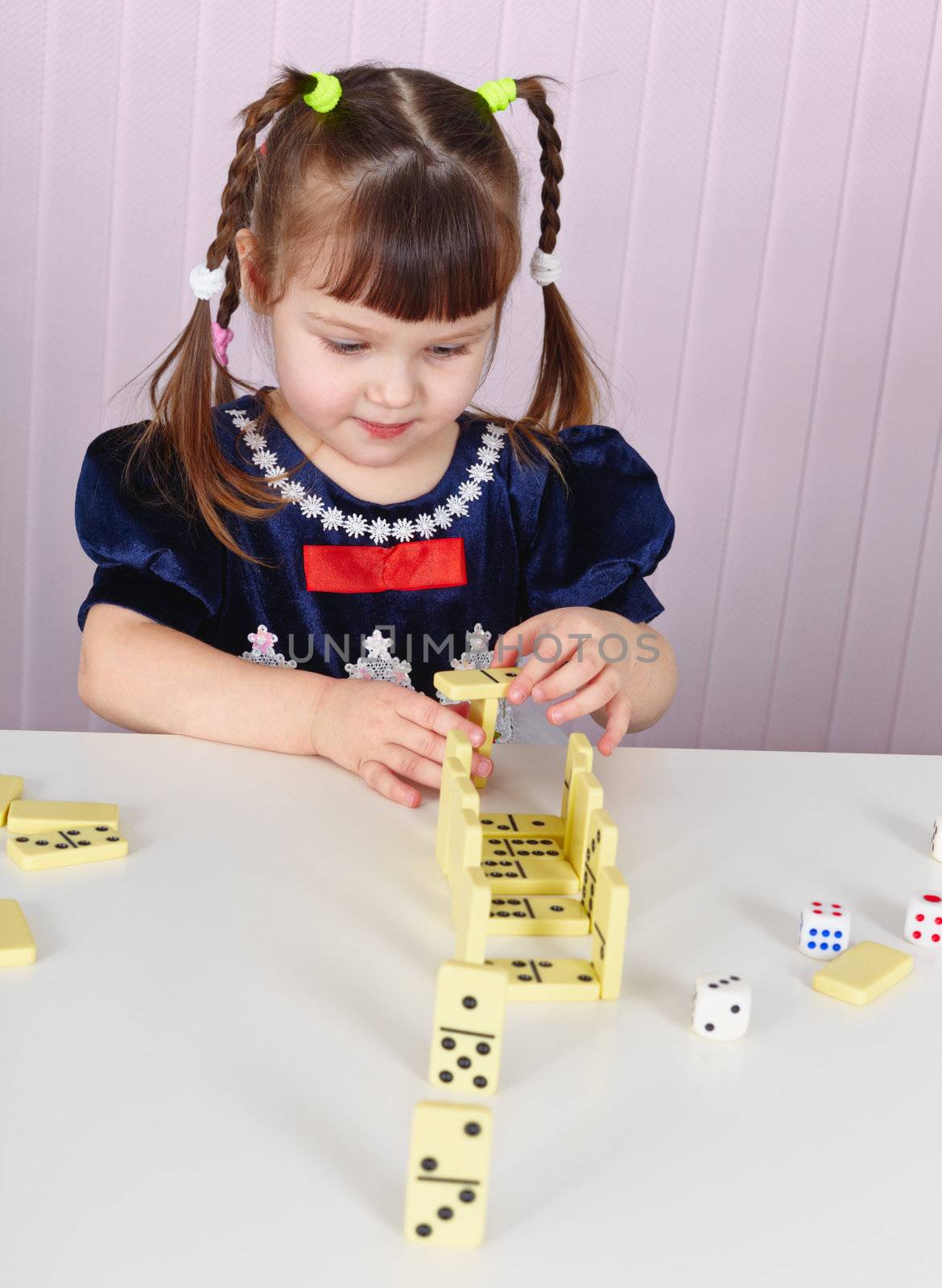 Child plays with toys at table by pzaxe