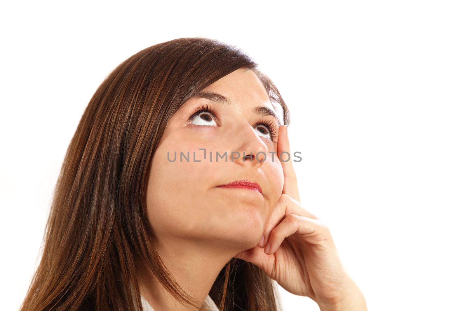 A young woman looking upwards reflectively and deliberately - with space for text