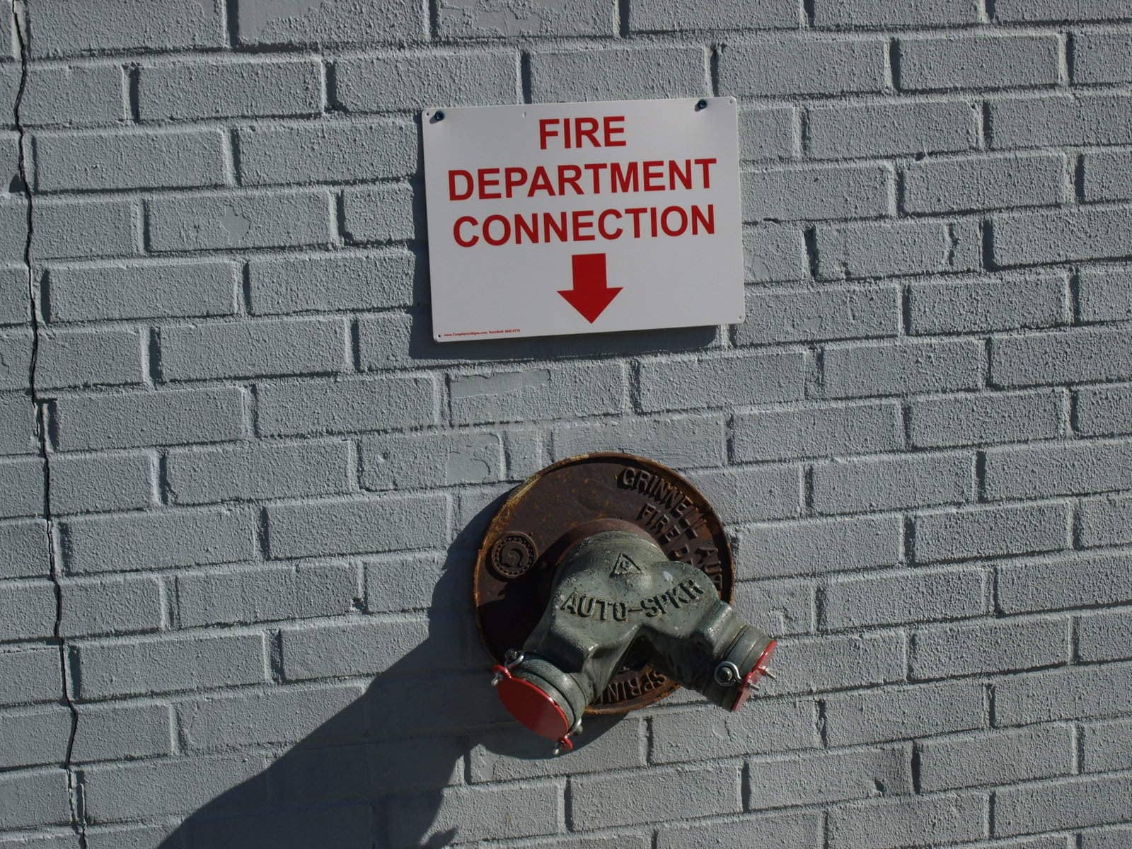 Fire plug on the wall in the city