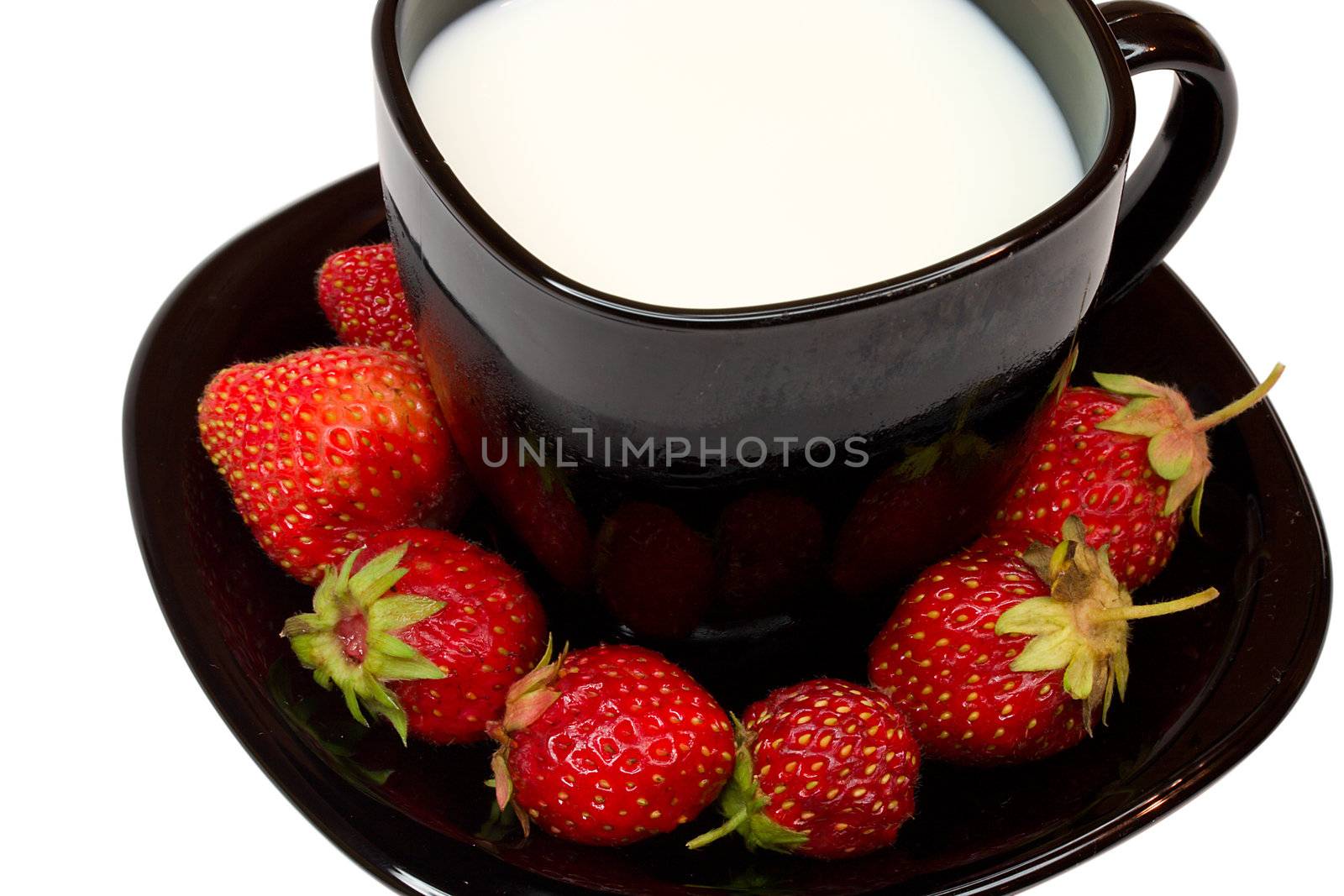 black cup of milk and strawberries, isolated on white