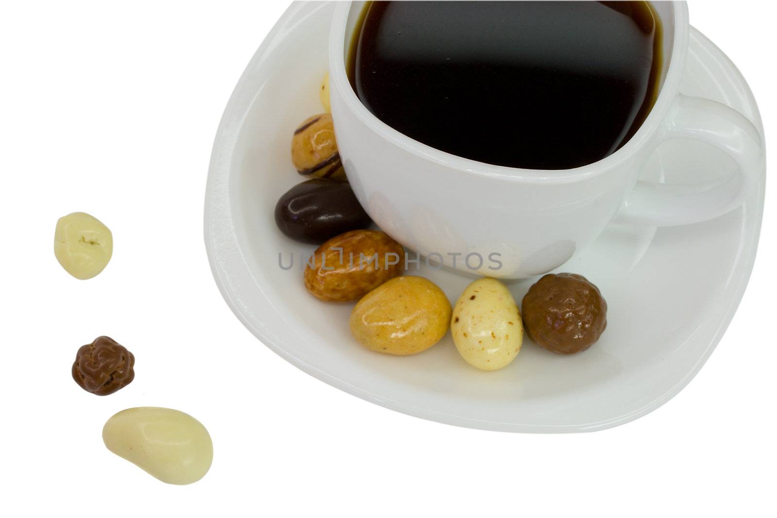 candies and white coffee cup, isolated on white