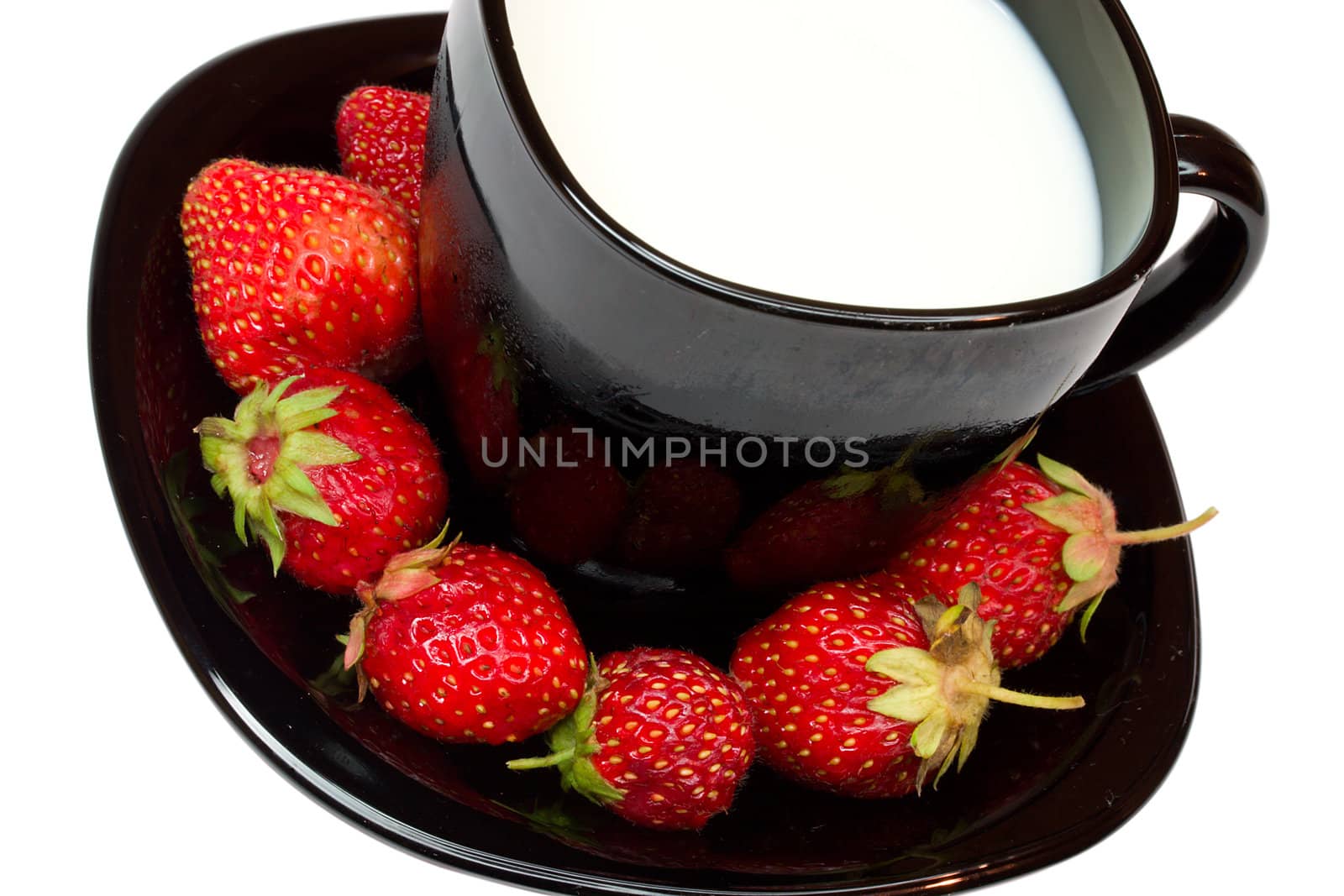 strawberries and black cup of milk, isolated on white