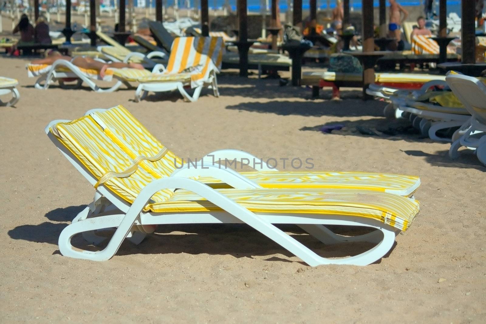 Egypt. Two sunbeds with mattresses are on the beach.