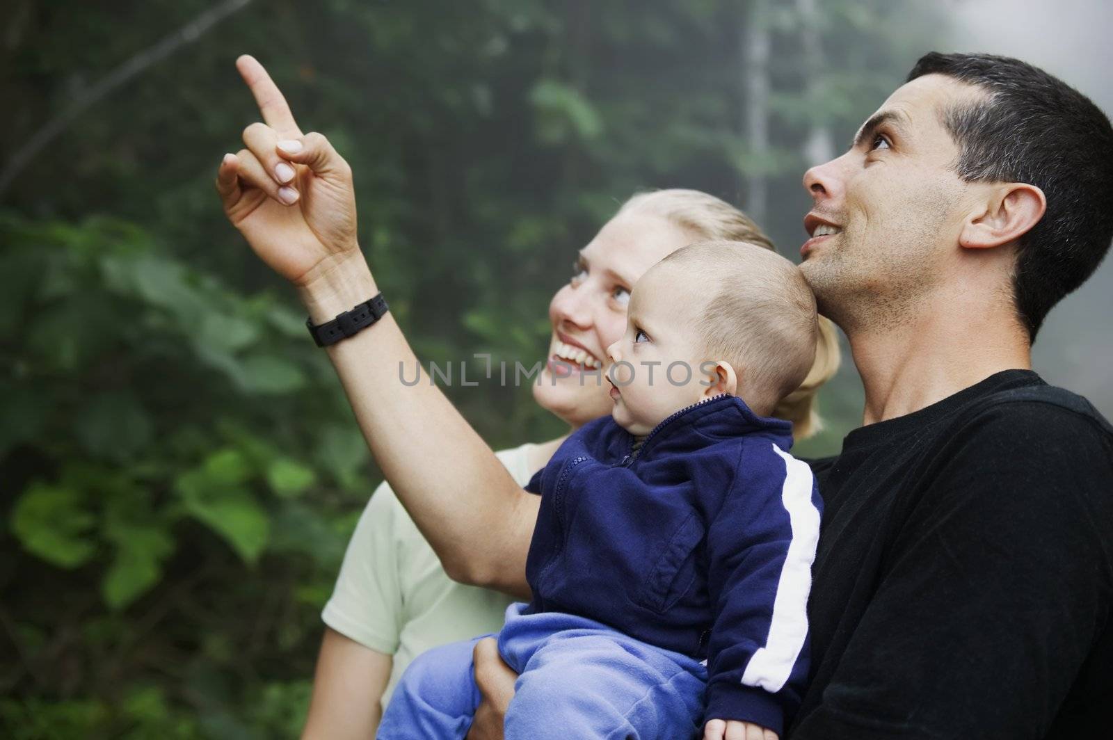 Mixed Hispanic Family with Cute Baby Boy in the Rain Forest by Creatista