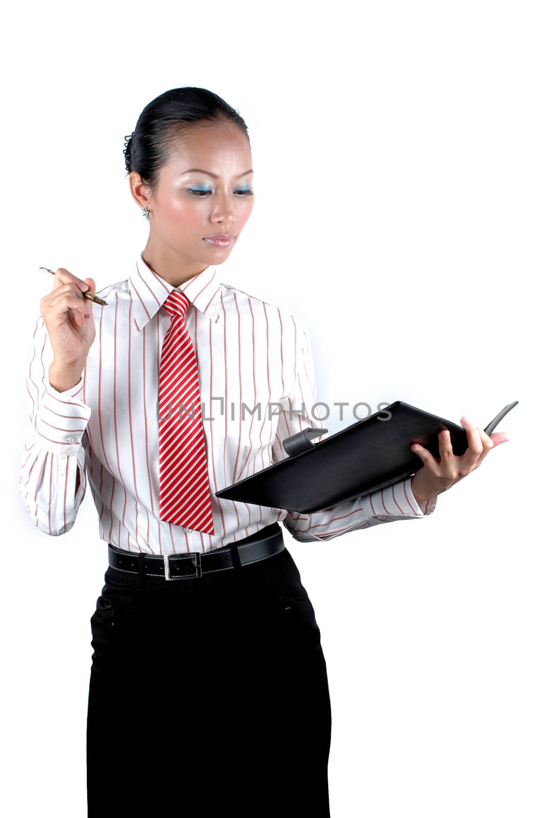 Pretty Chinese office girl holding pen and notebook, serious face expression - business meeting.