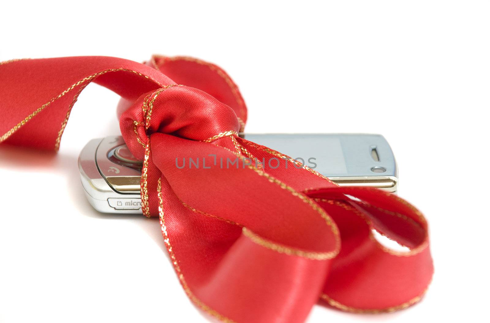close-up on a brand new shiny mobile phone, isolated on white