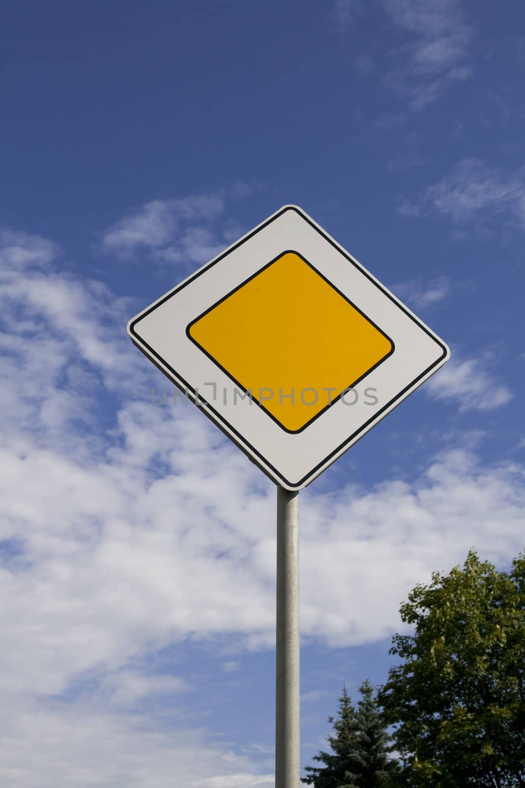 Traffic signs - the main road on blue sky background