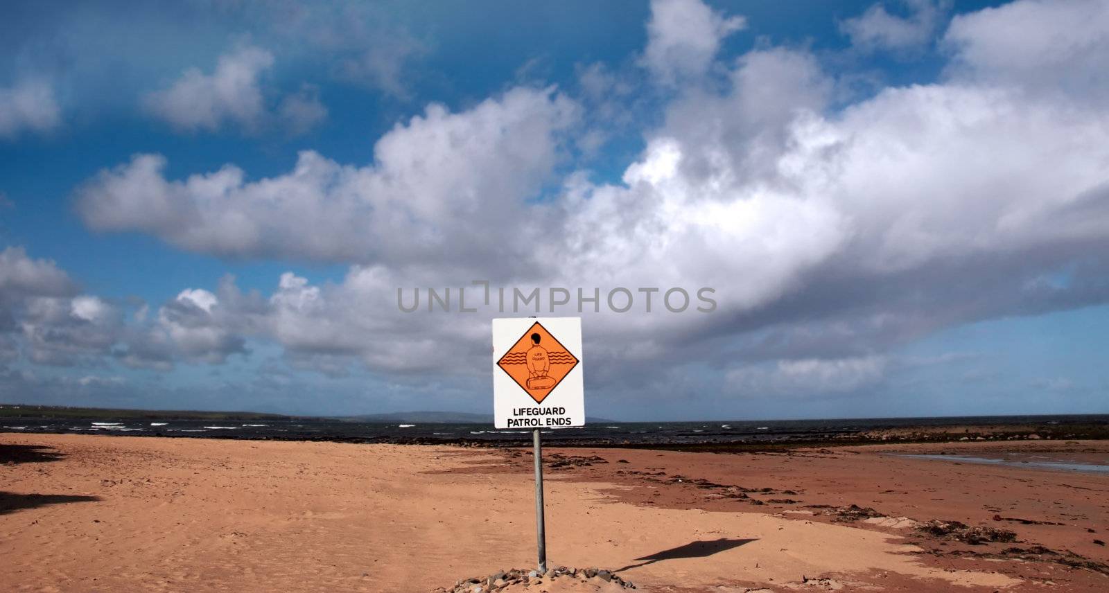 a sign warning that there is no lifeguard patrol beyond this sign