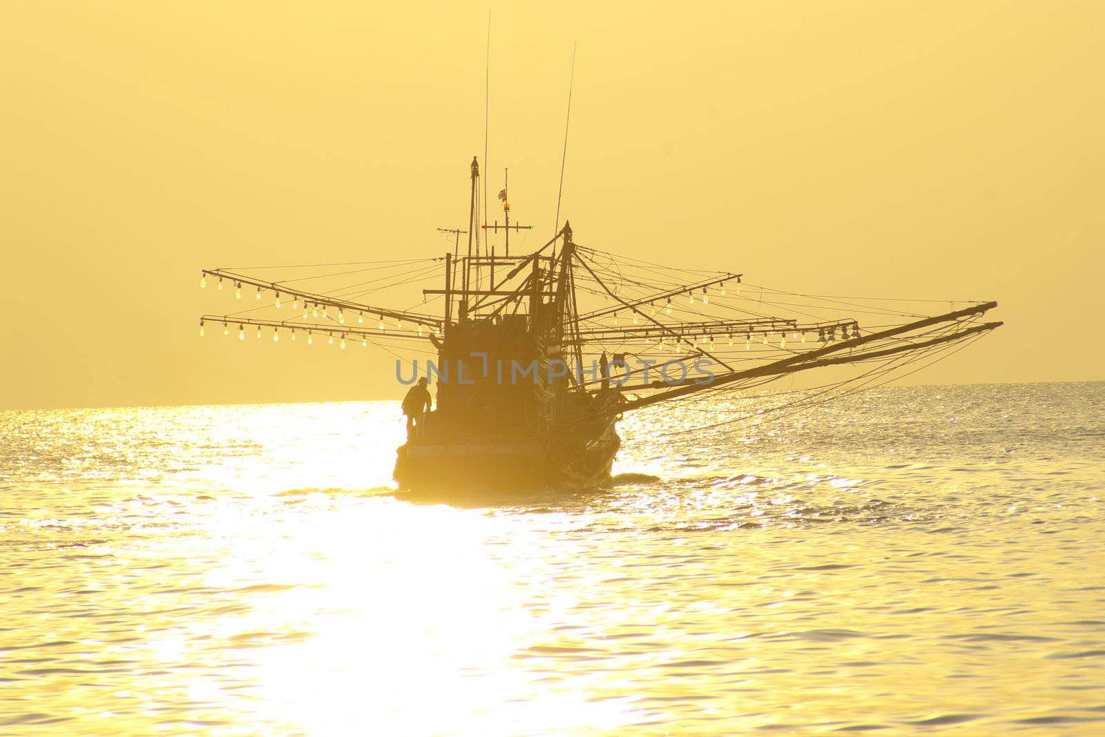 Fishing boat at sunset