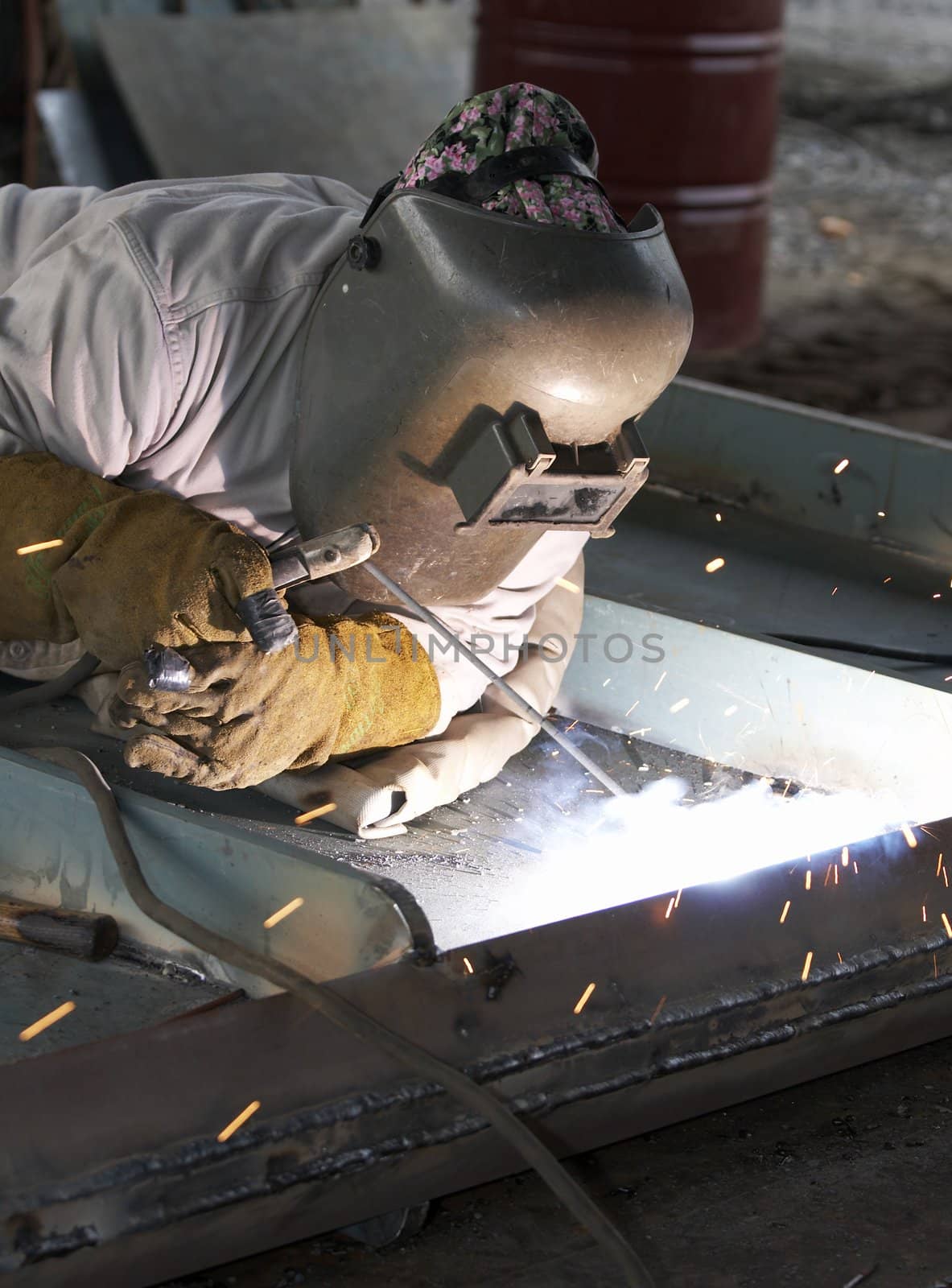 a welder working at shipyard during day shift