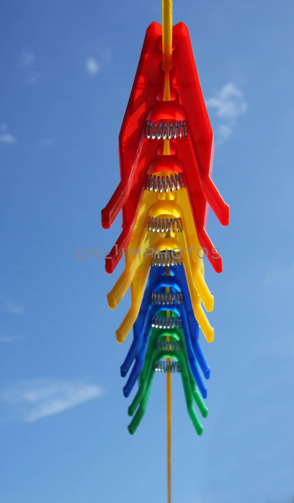 Pegs on washing clothes laundry line, blue sky